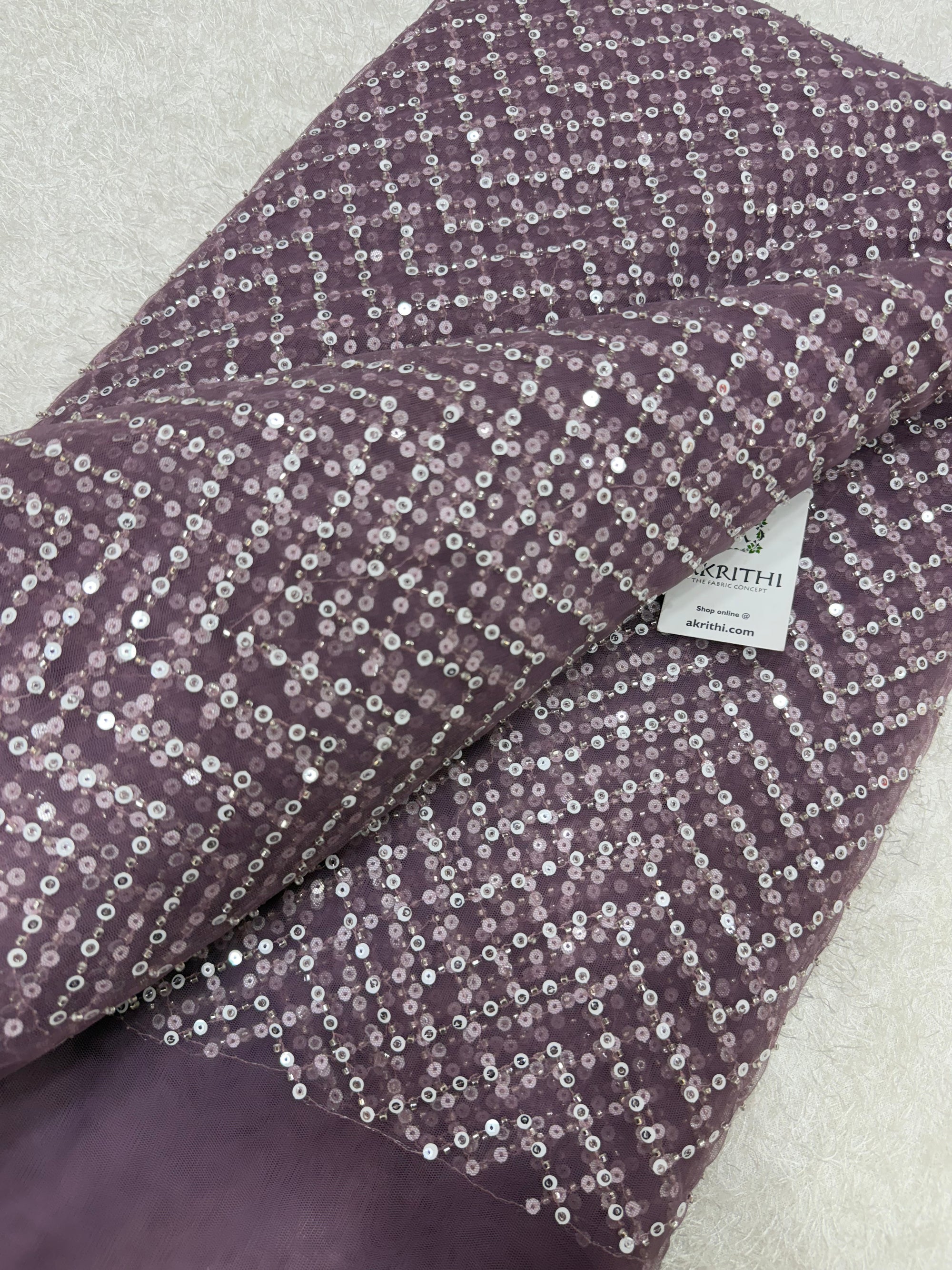 Embroidered net fabric