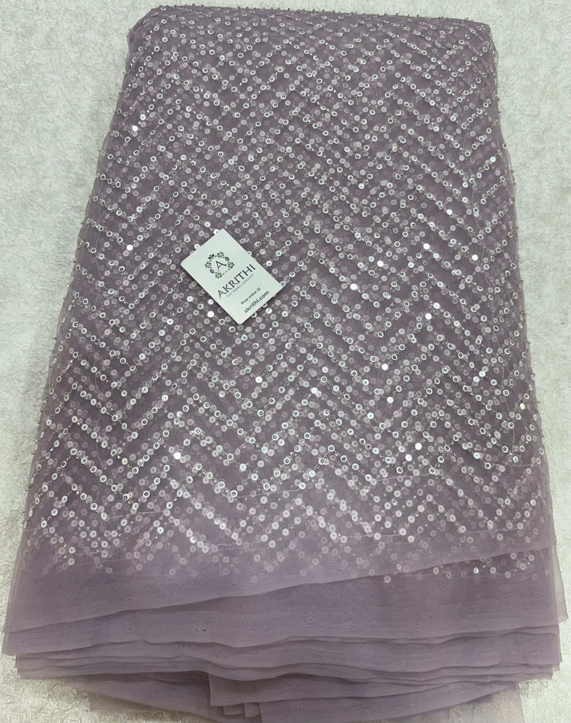 Embroidered net fabric