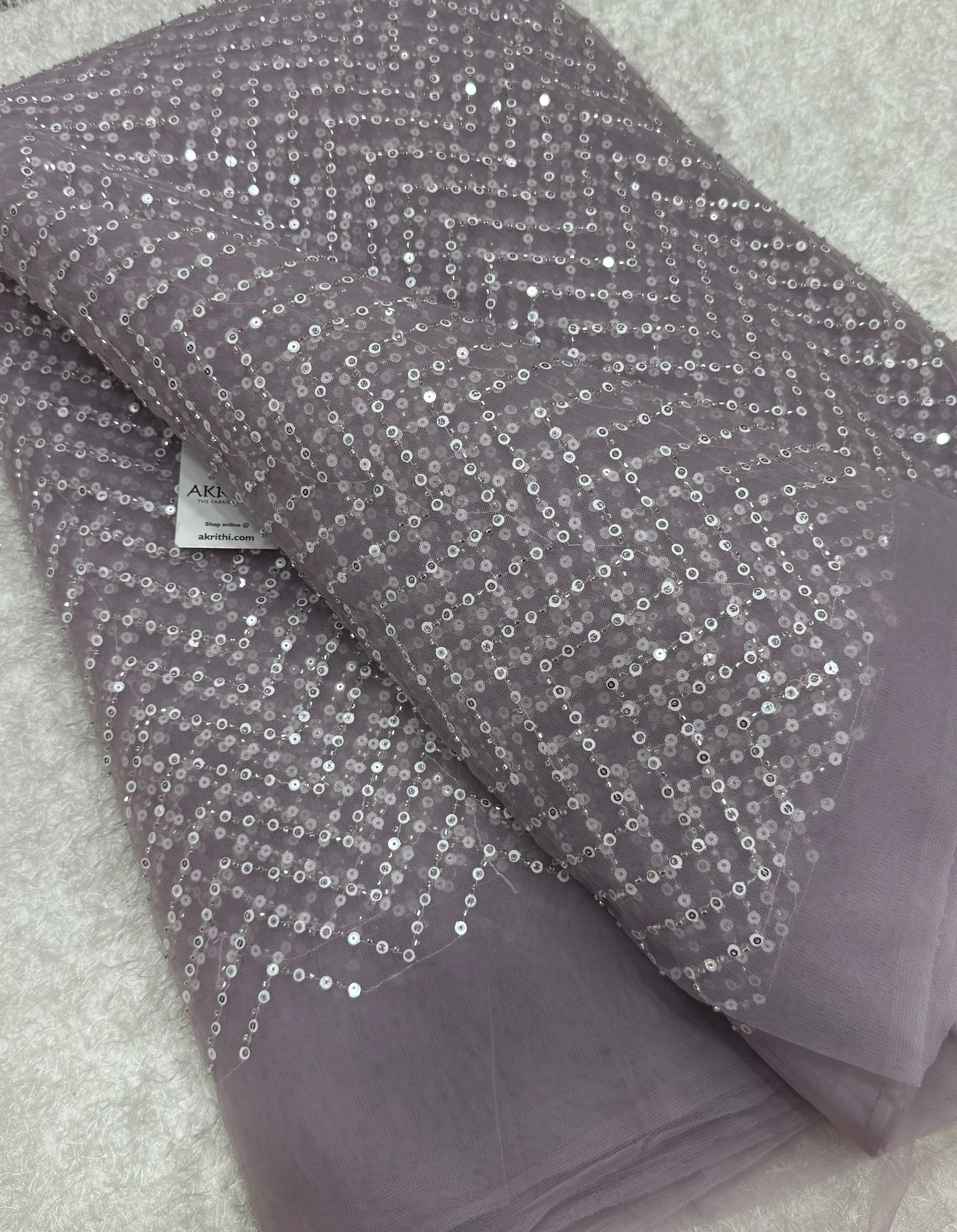 Embroidered net fabric