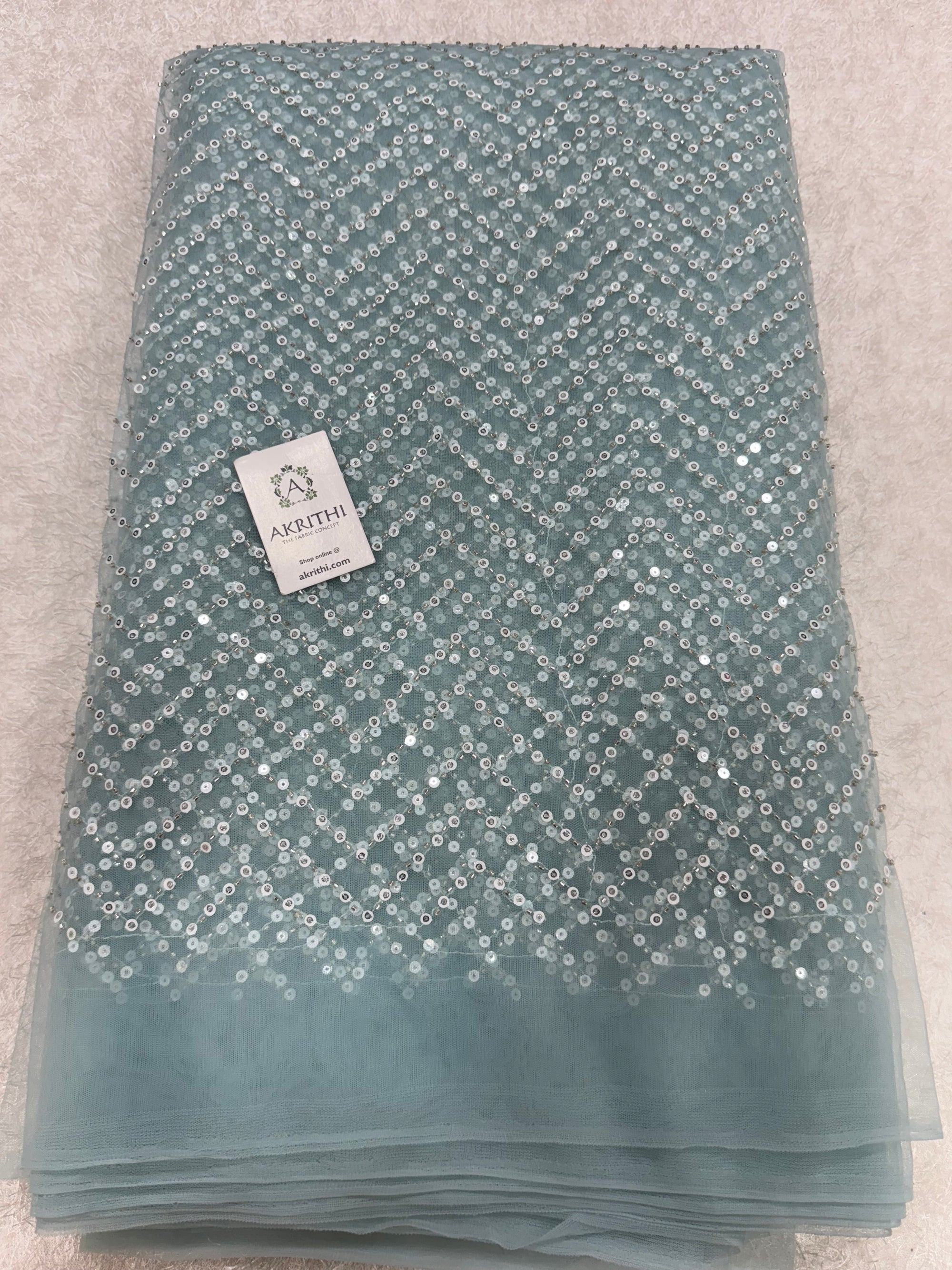 Embroidered net fabric