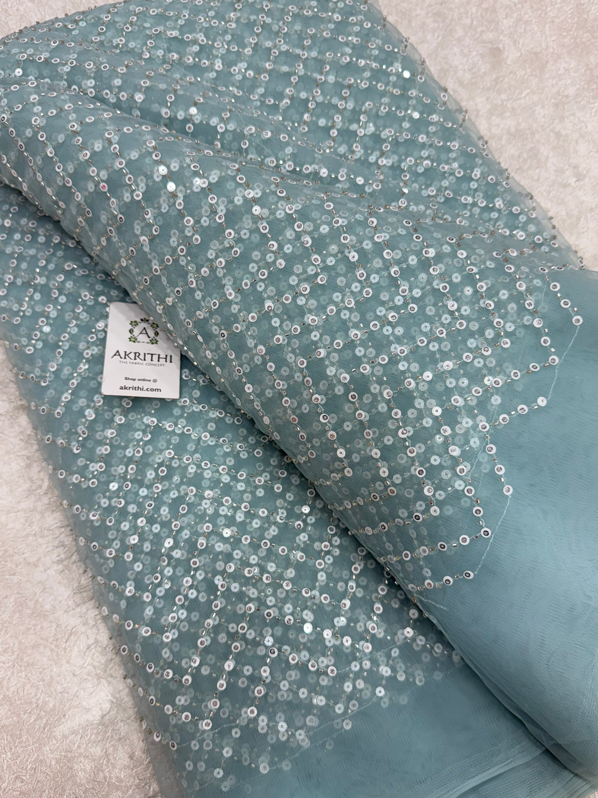 Embroidered net fabric