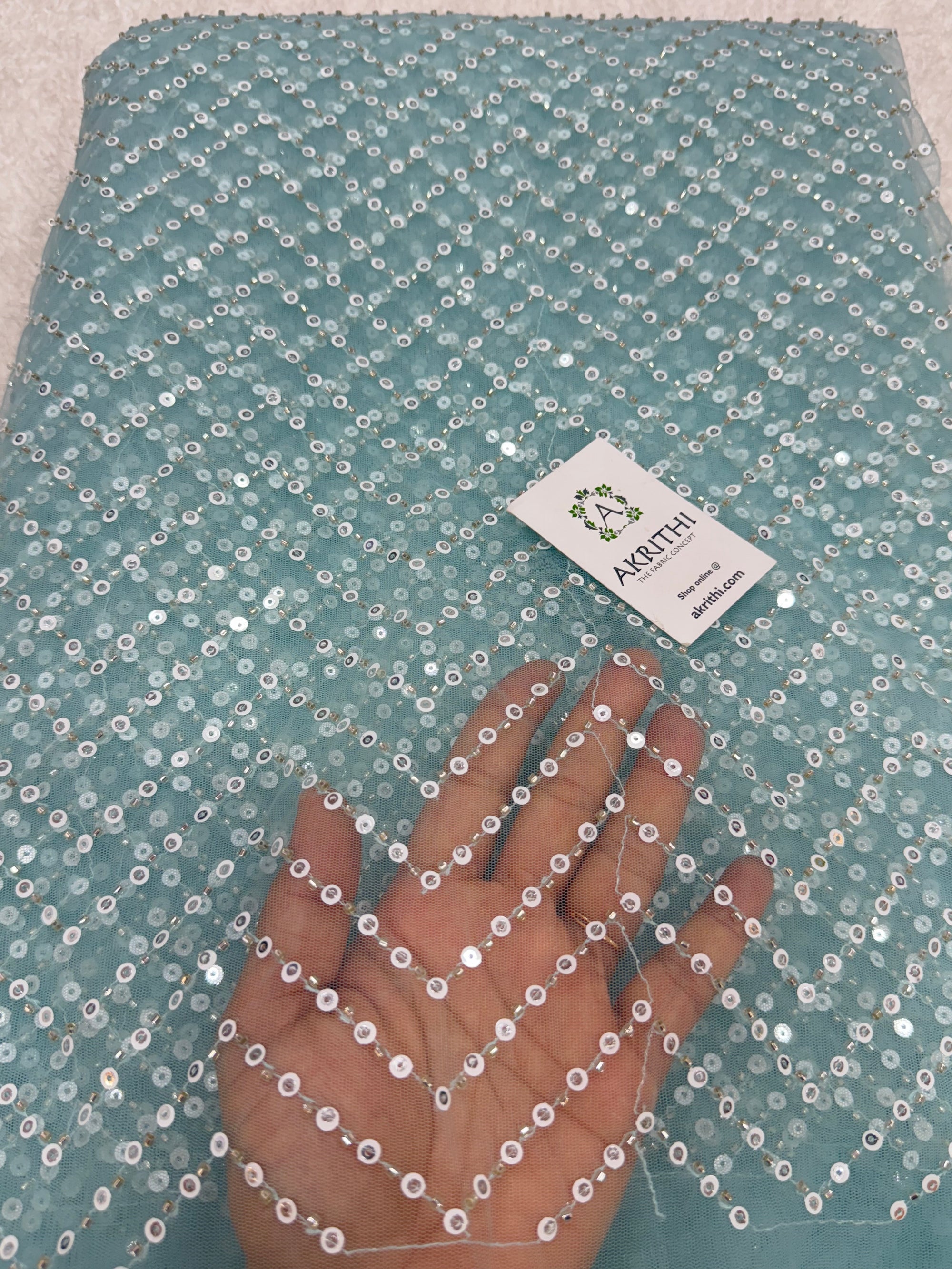 Embroidered net fabric