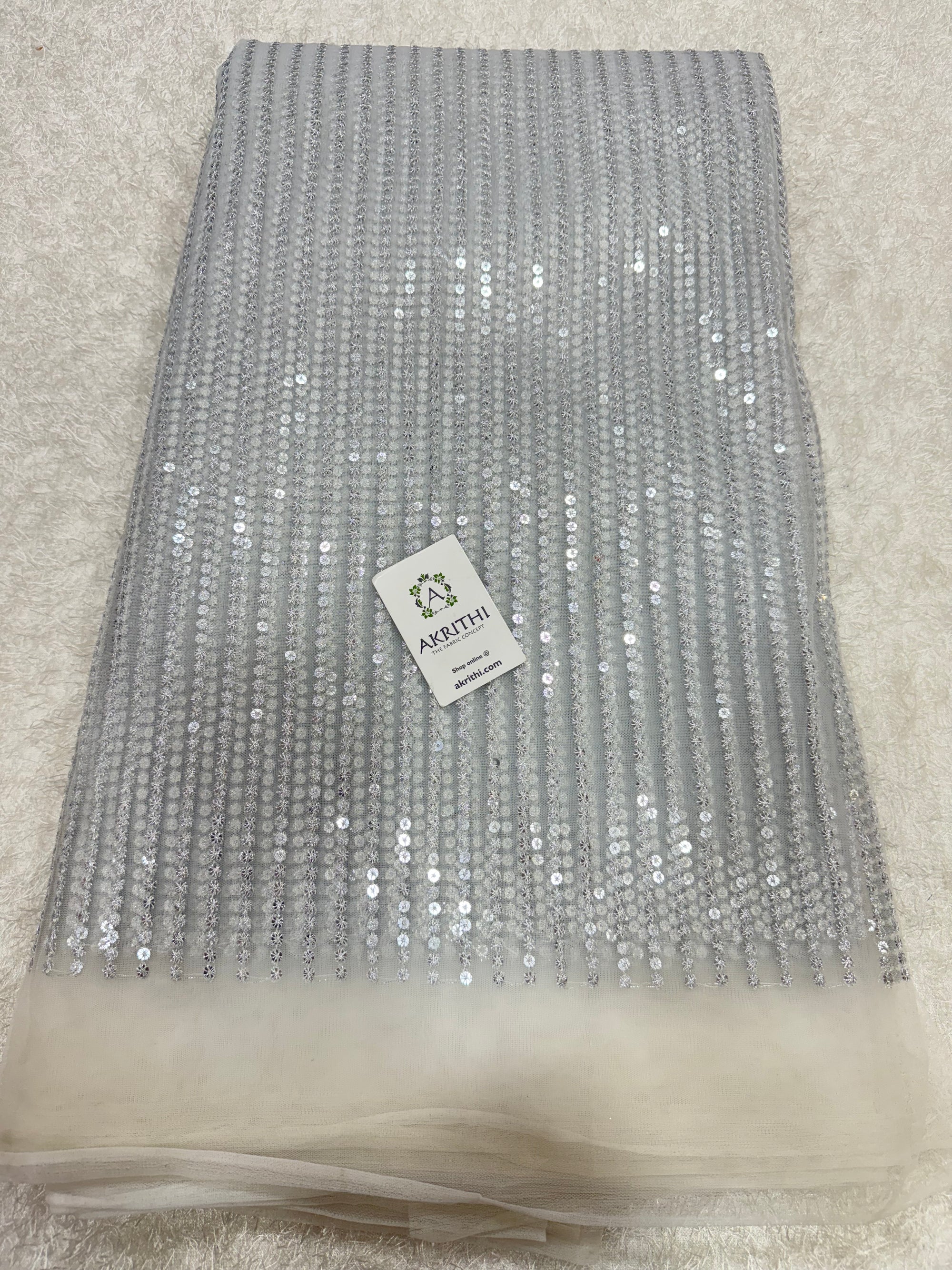 Embroidered net fabric