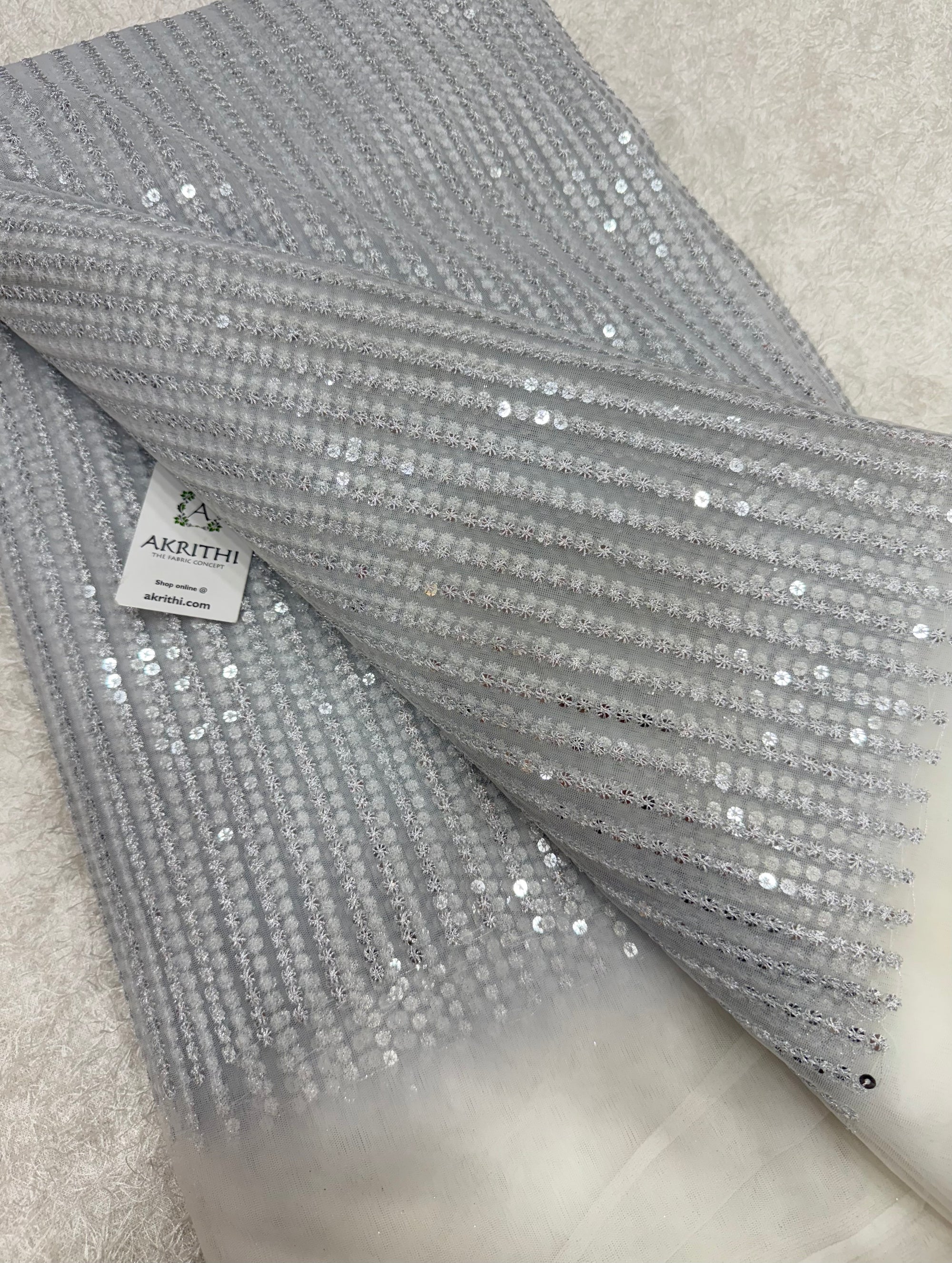 Embroidered net fabric