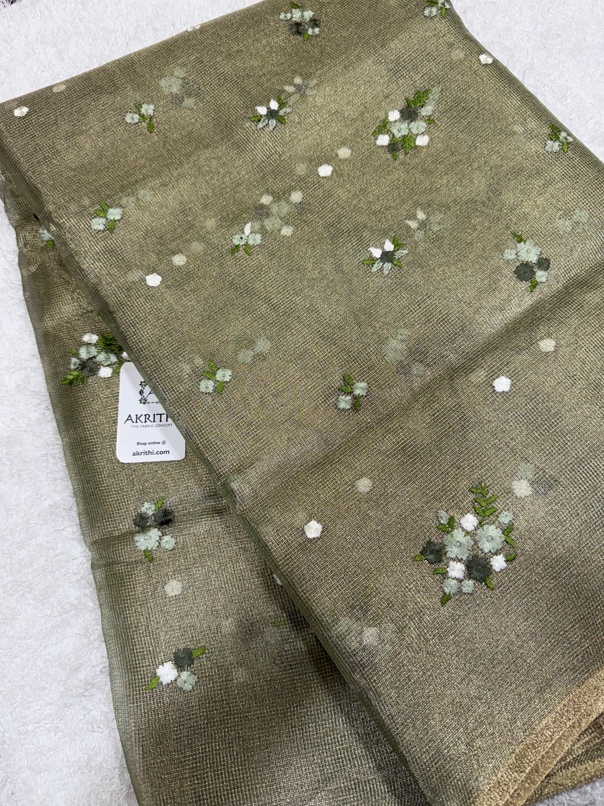 Embroidered tissue net fabric