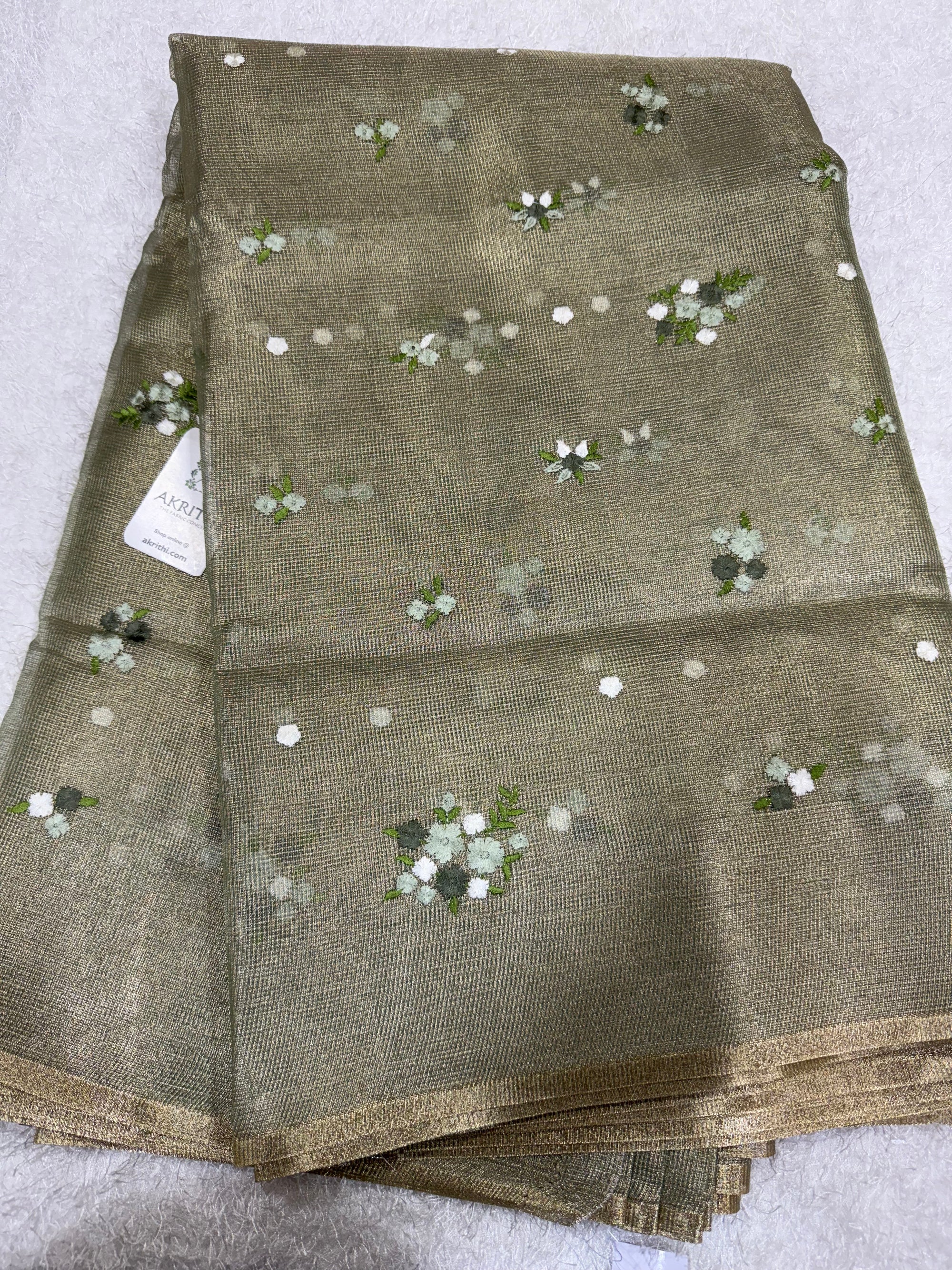 Embroidered tissue net fabric