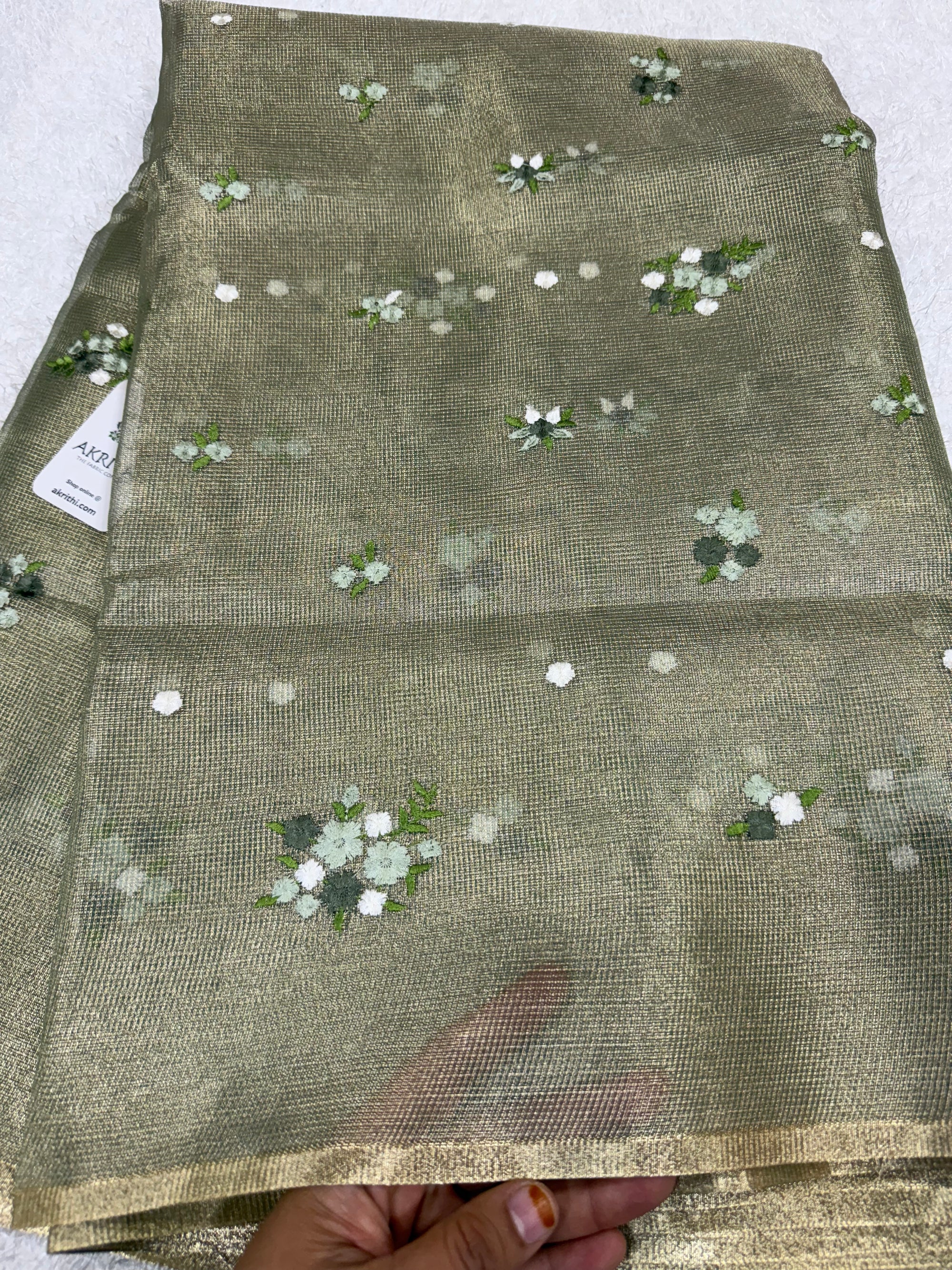 Embroidered tissue net fabric