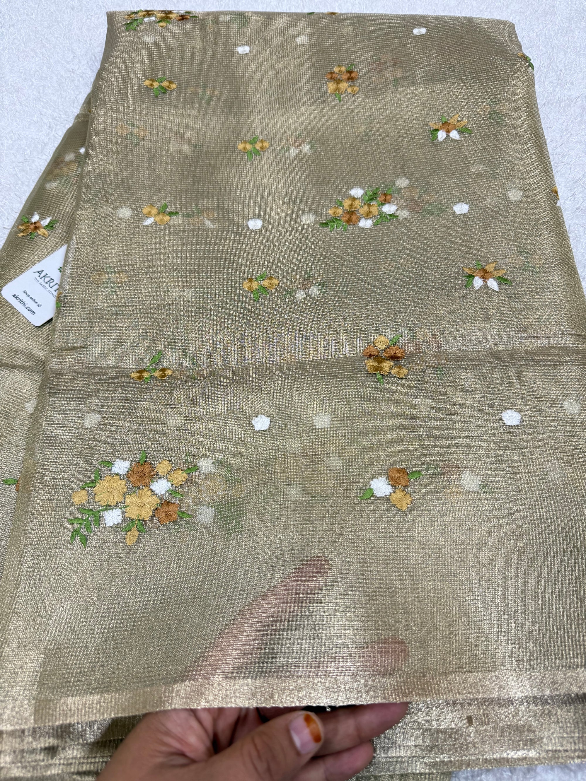Embroidered tissue net fabric