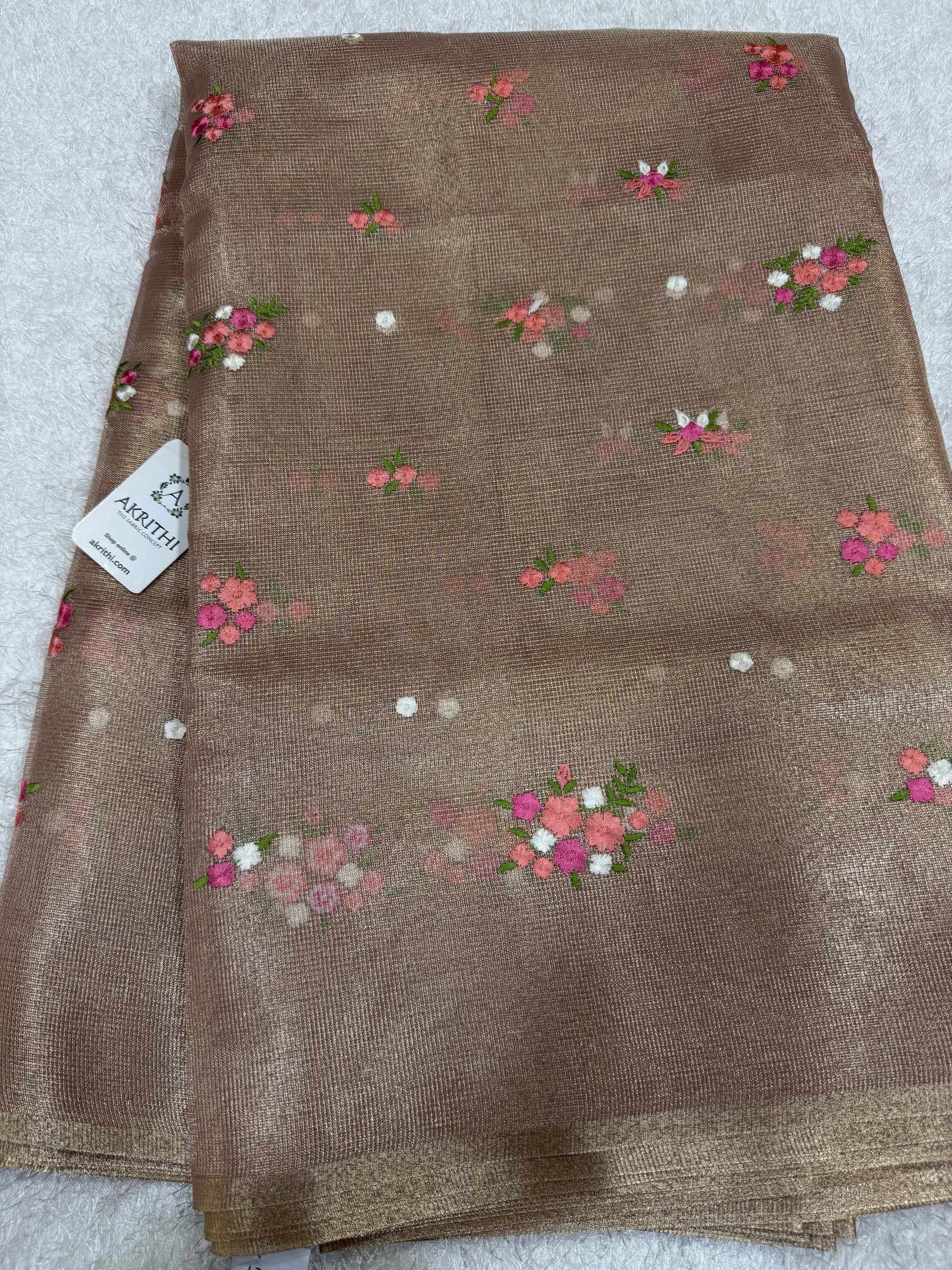 Embroidered tissue net fabric