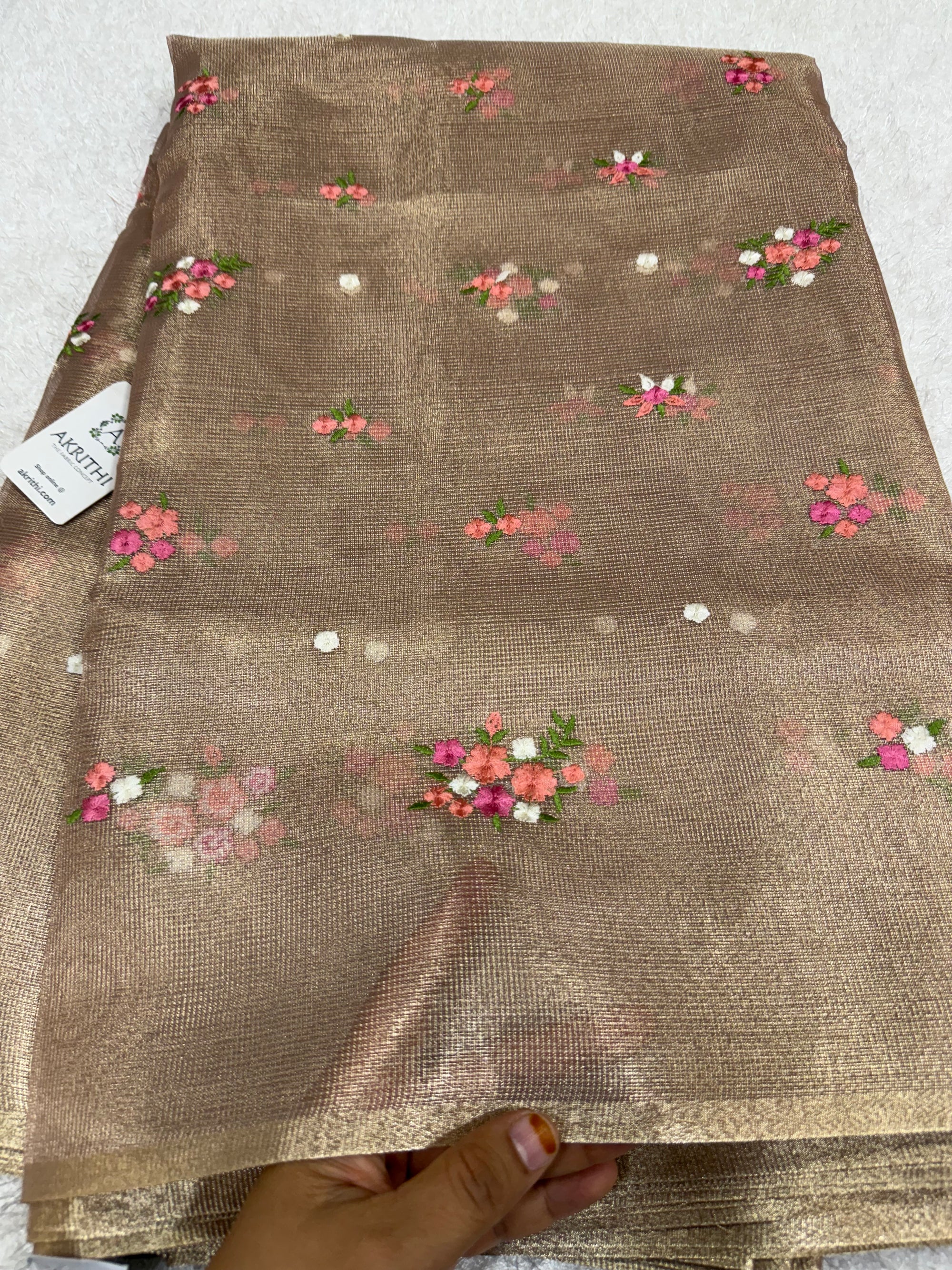 Embroidered tissue net fabric
