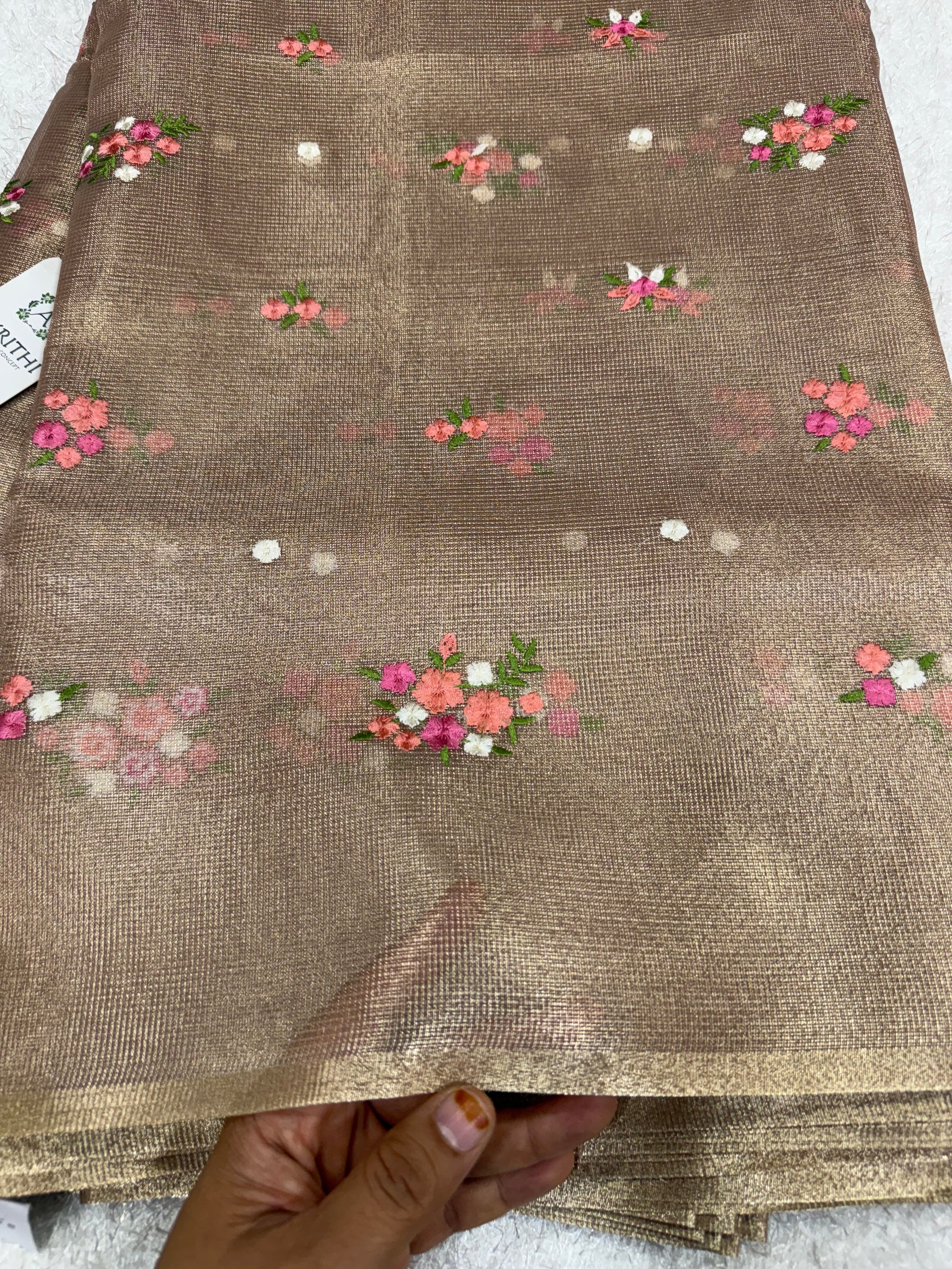 Embroidered tissue net fabric