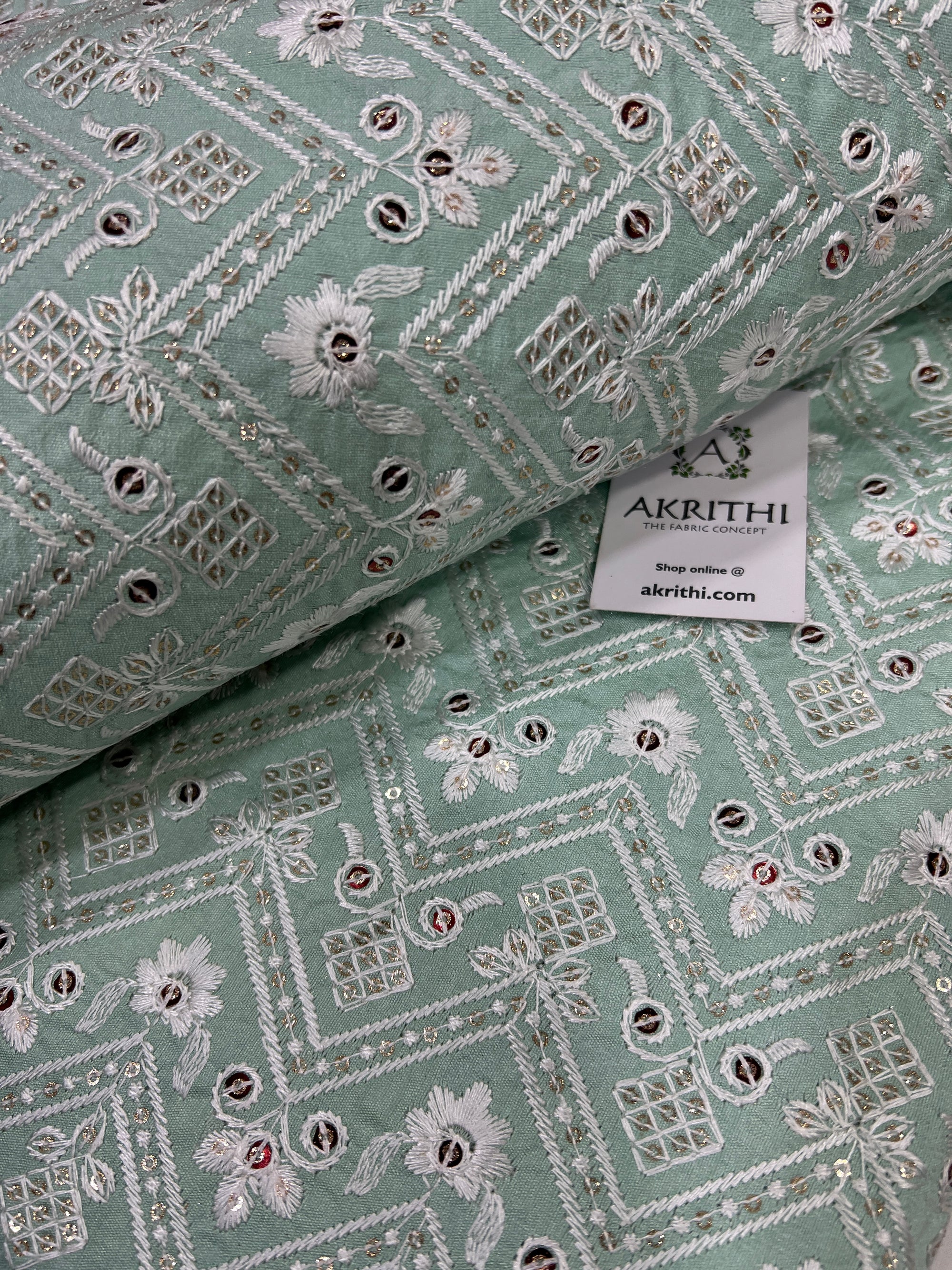 Embroidered raw silk fabric