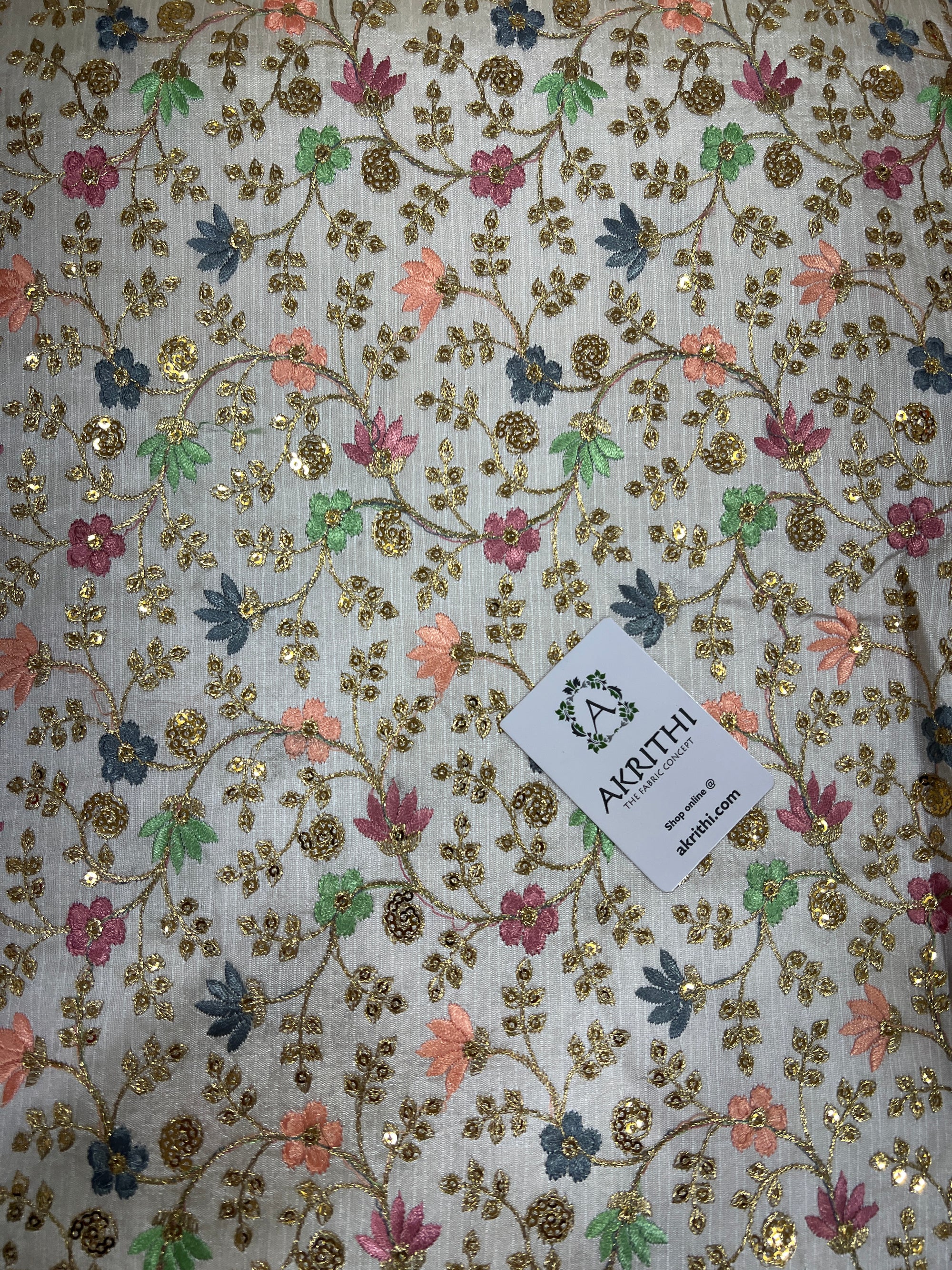 Embroidered raw silk fabric