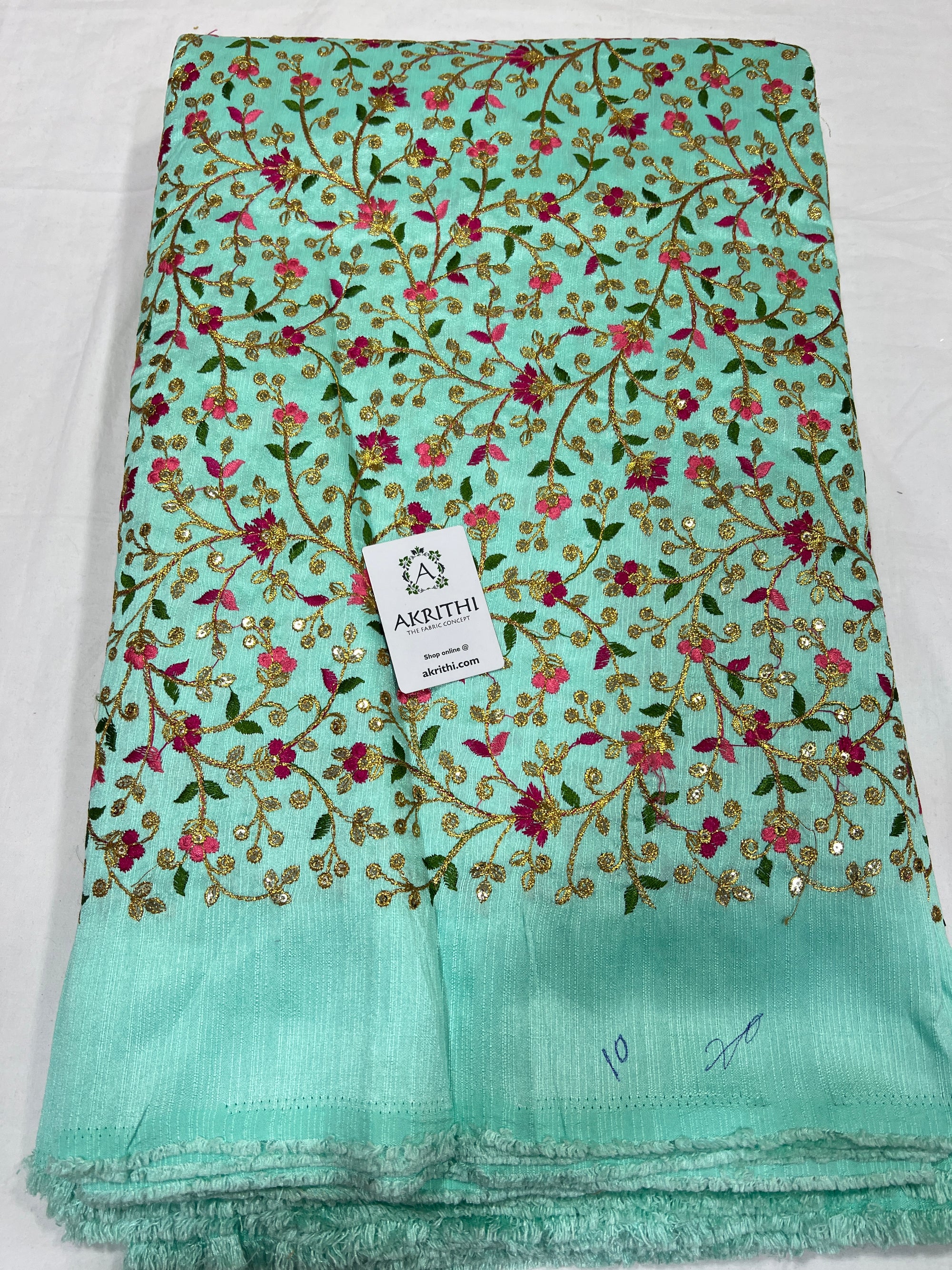 Embroidered raw silk fabric
