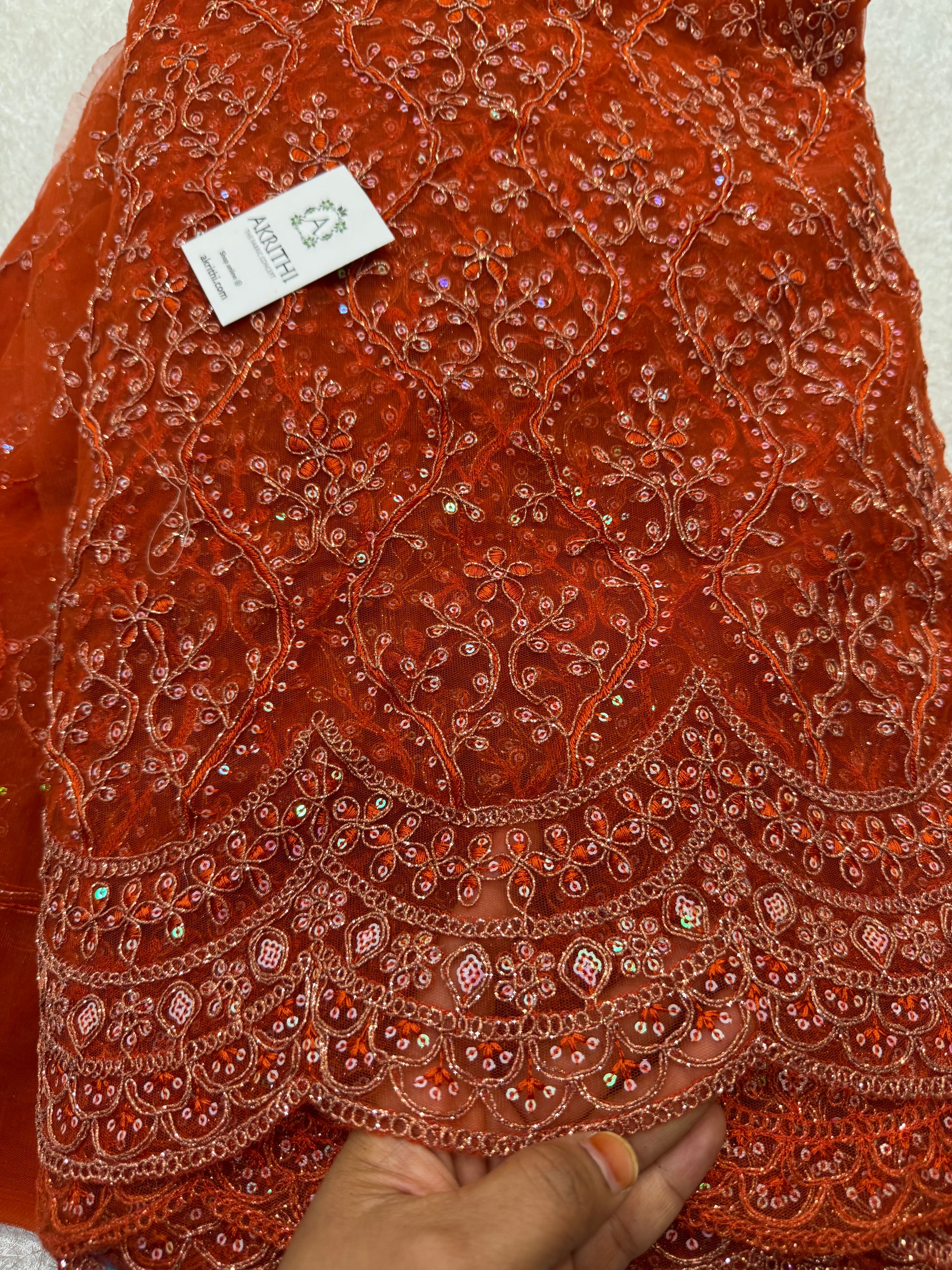 Embroidered net fabric
