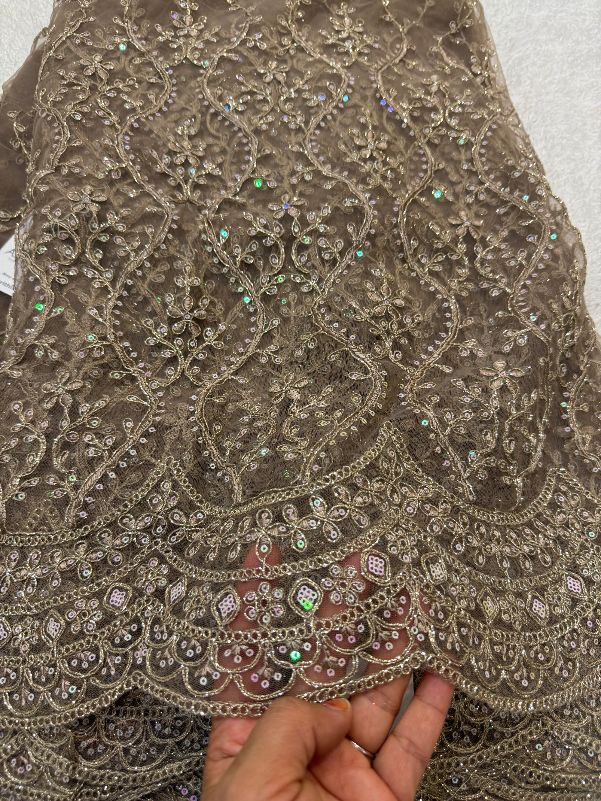 Embroidered net fabric