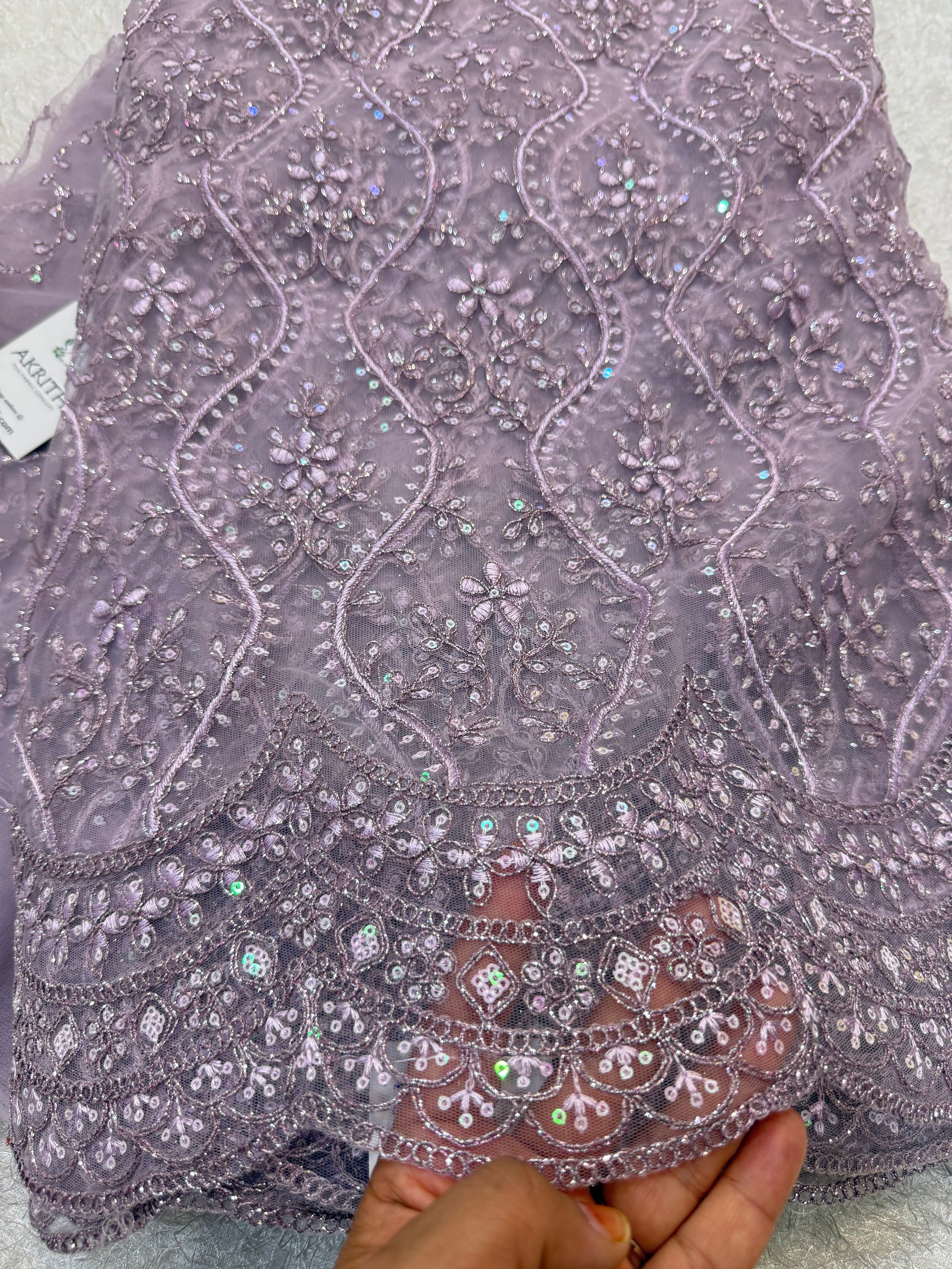 Embroidered net fabric
