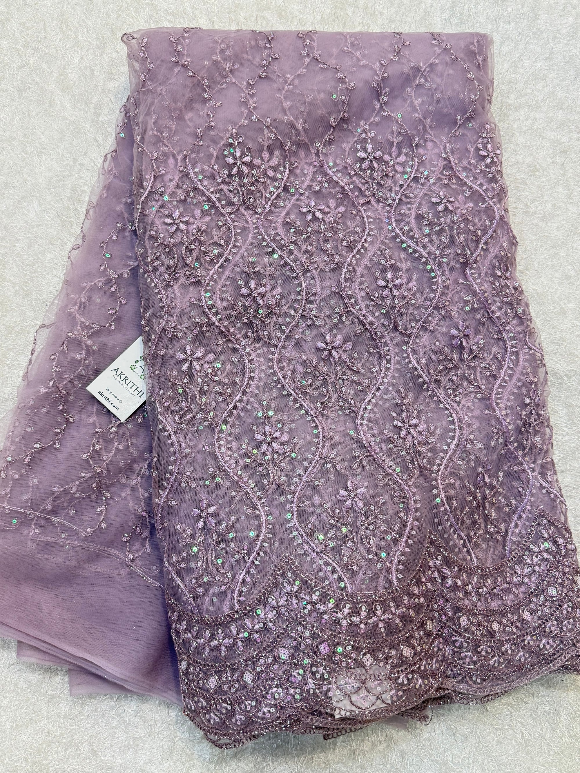 Embroidered net fabric