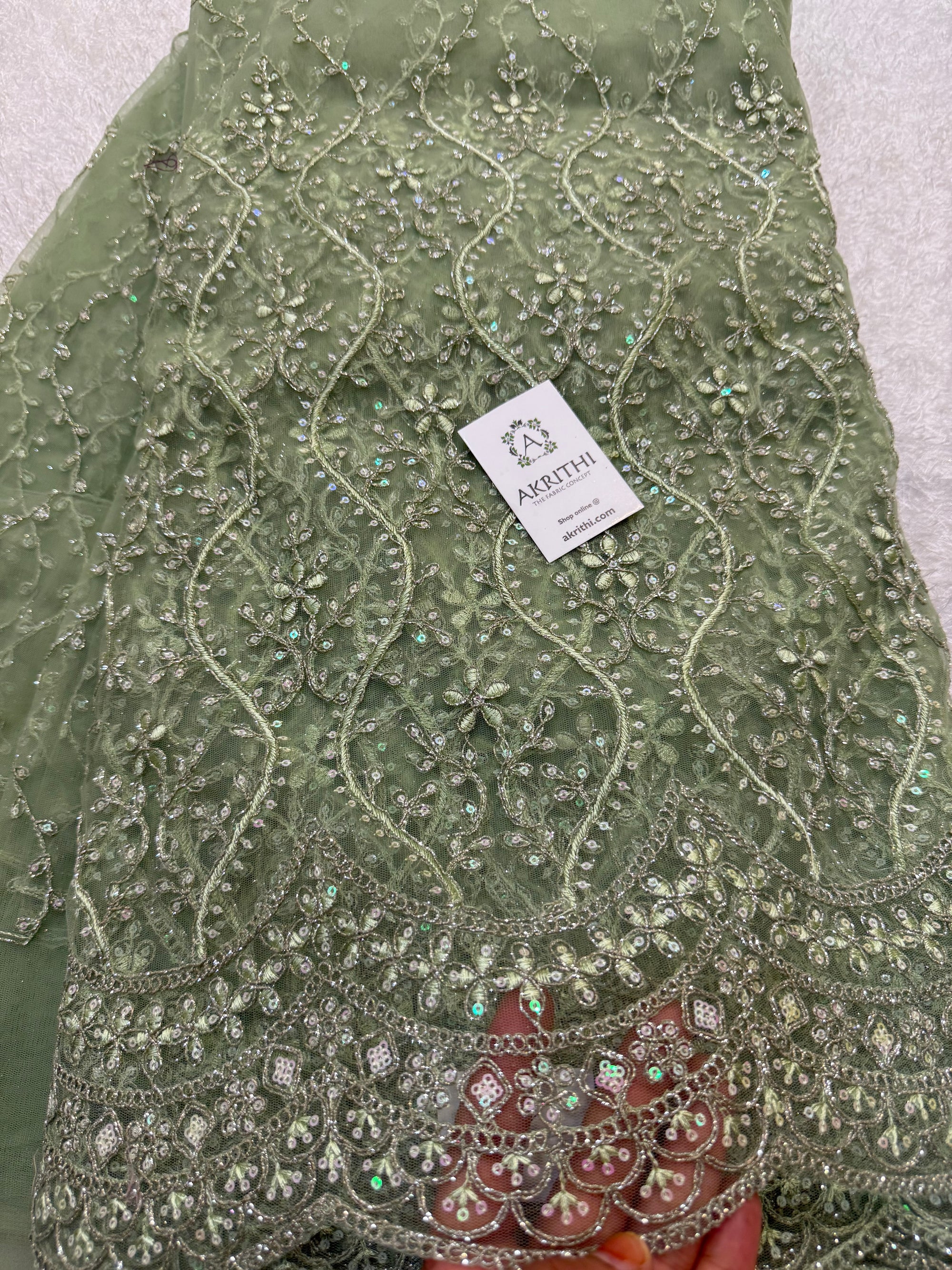 Embroidered net fabric