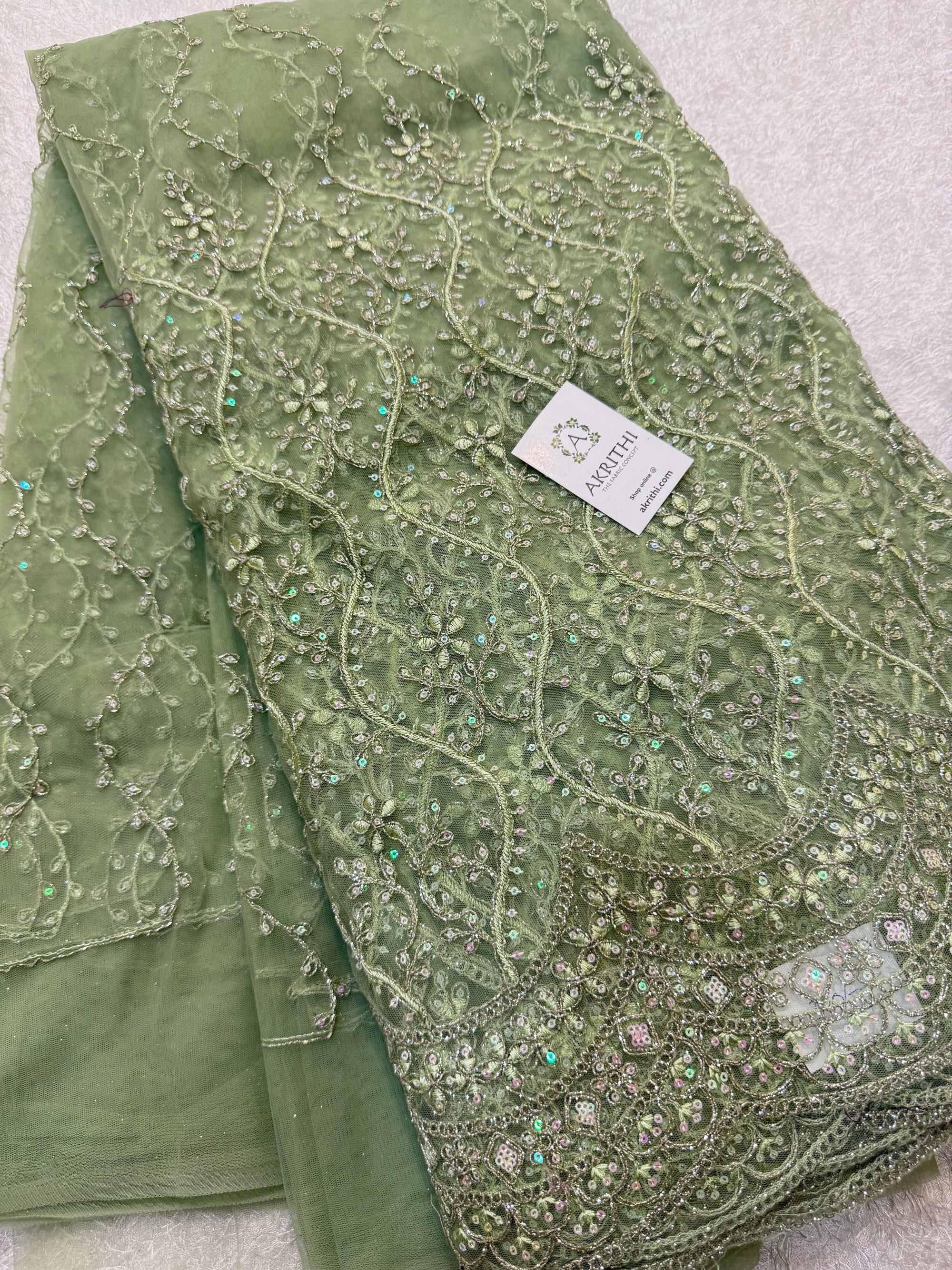 Embroidered net fabric