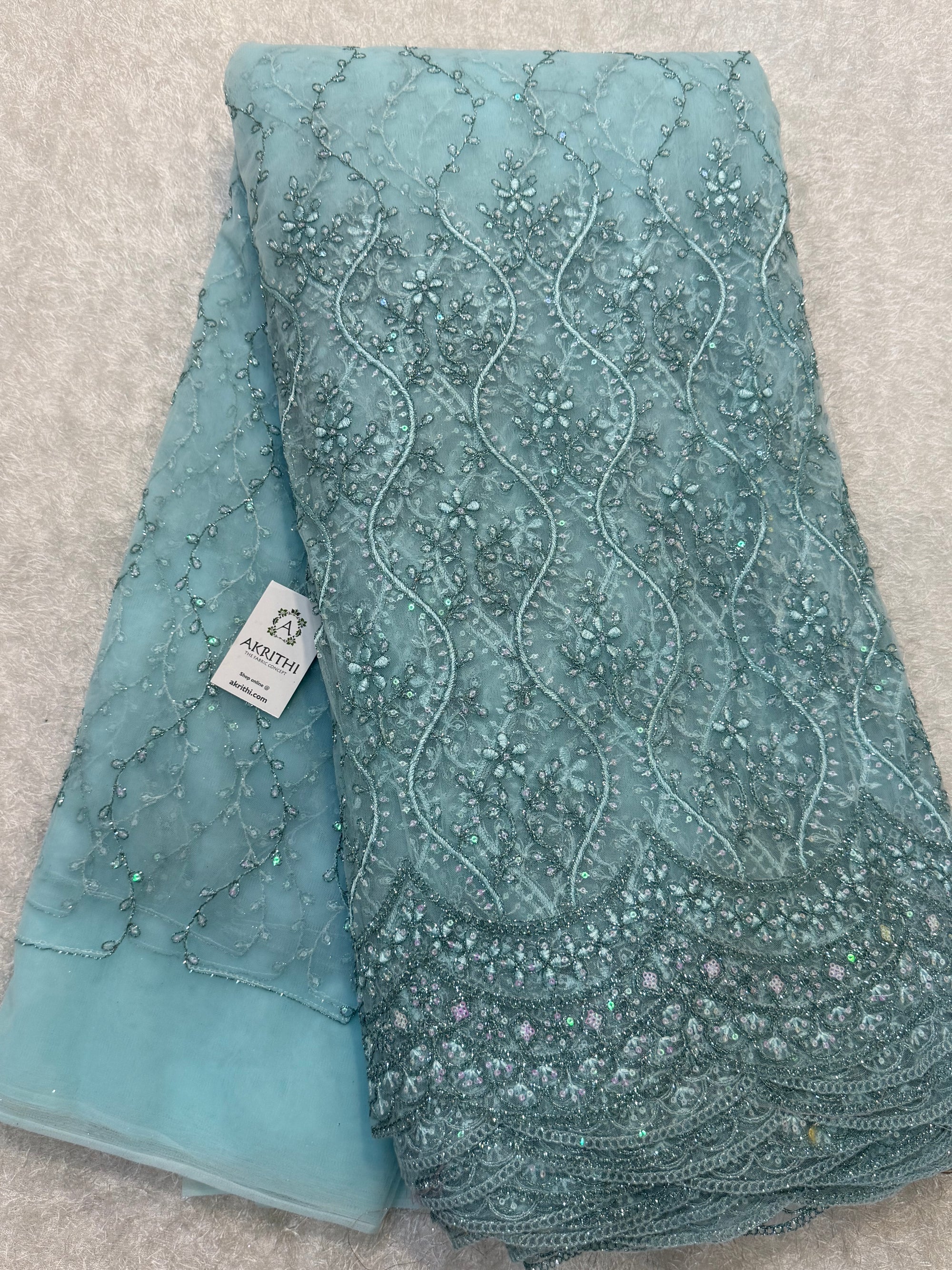 Embroidered net fabric