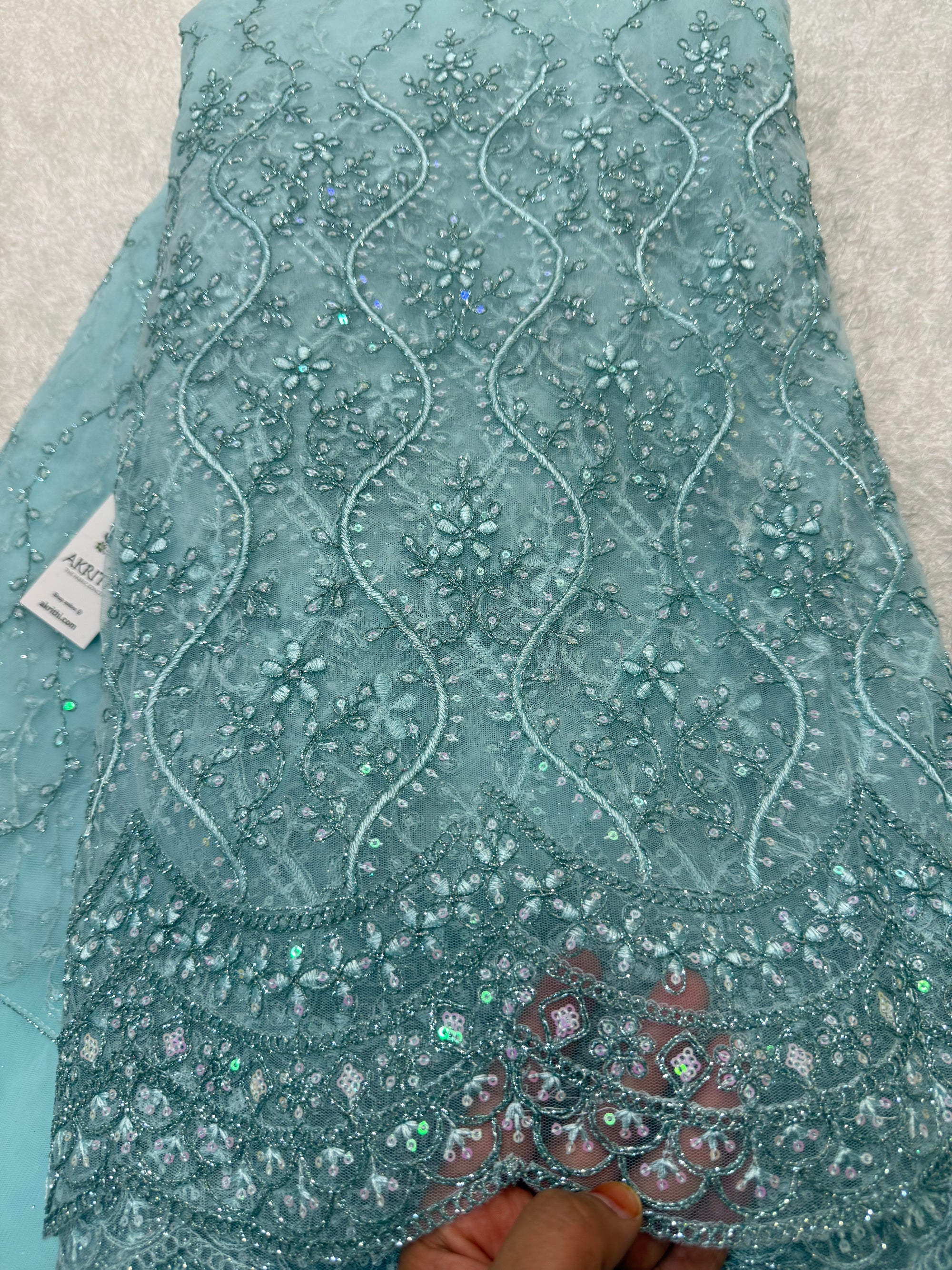 Embroidered net fabric