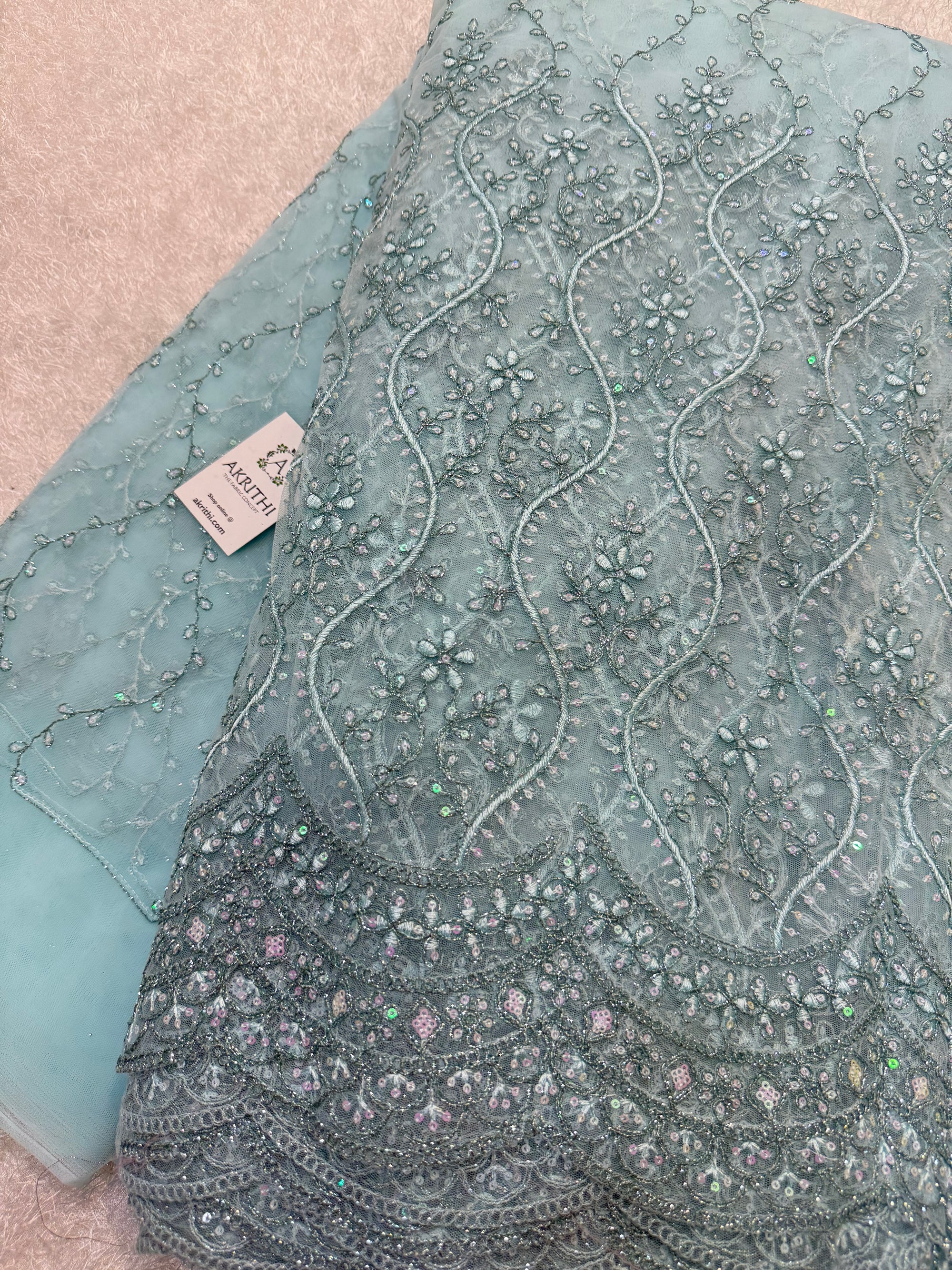 Embroidered net fabric