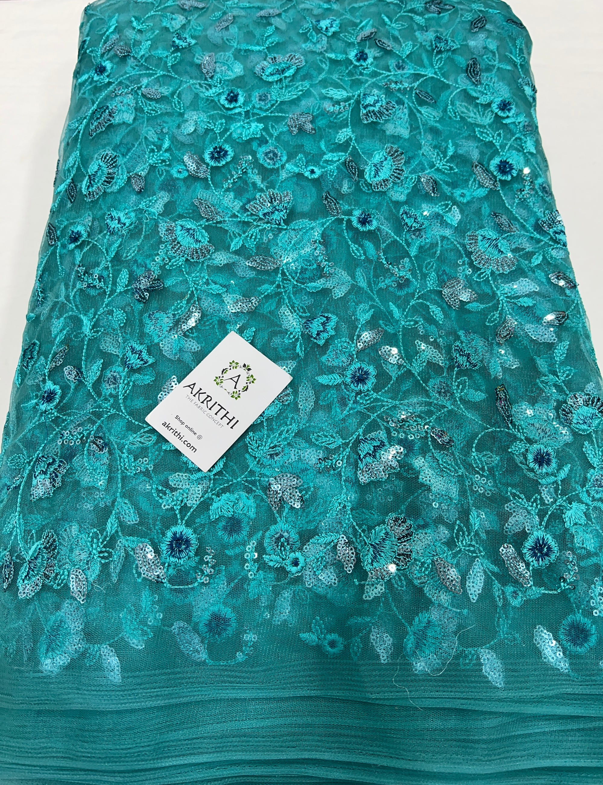 Embroidered net fabric