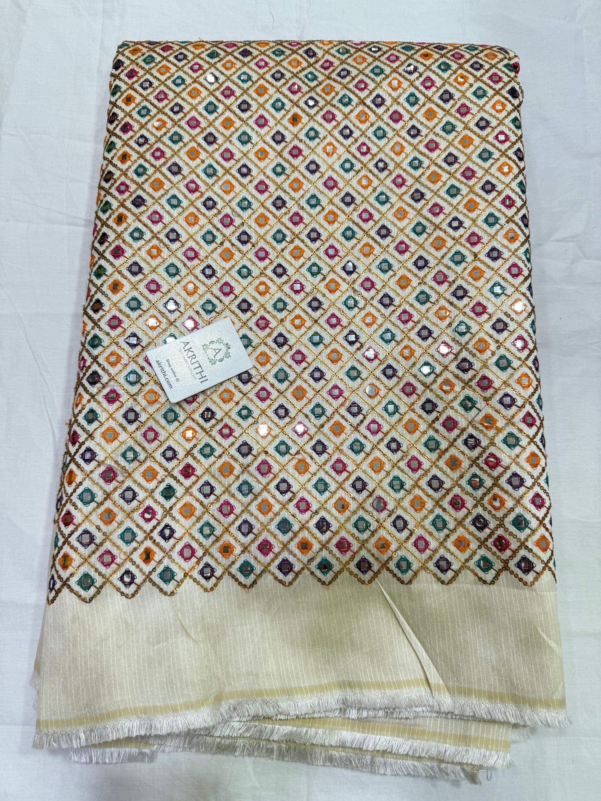 Embroidered raw silk fabric