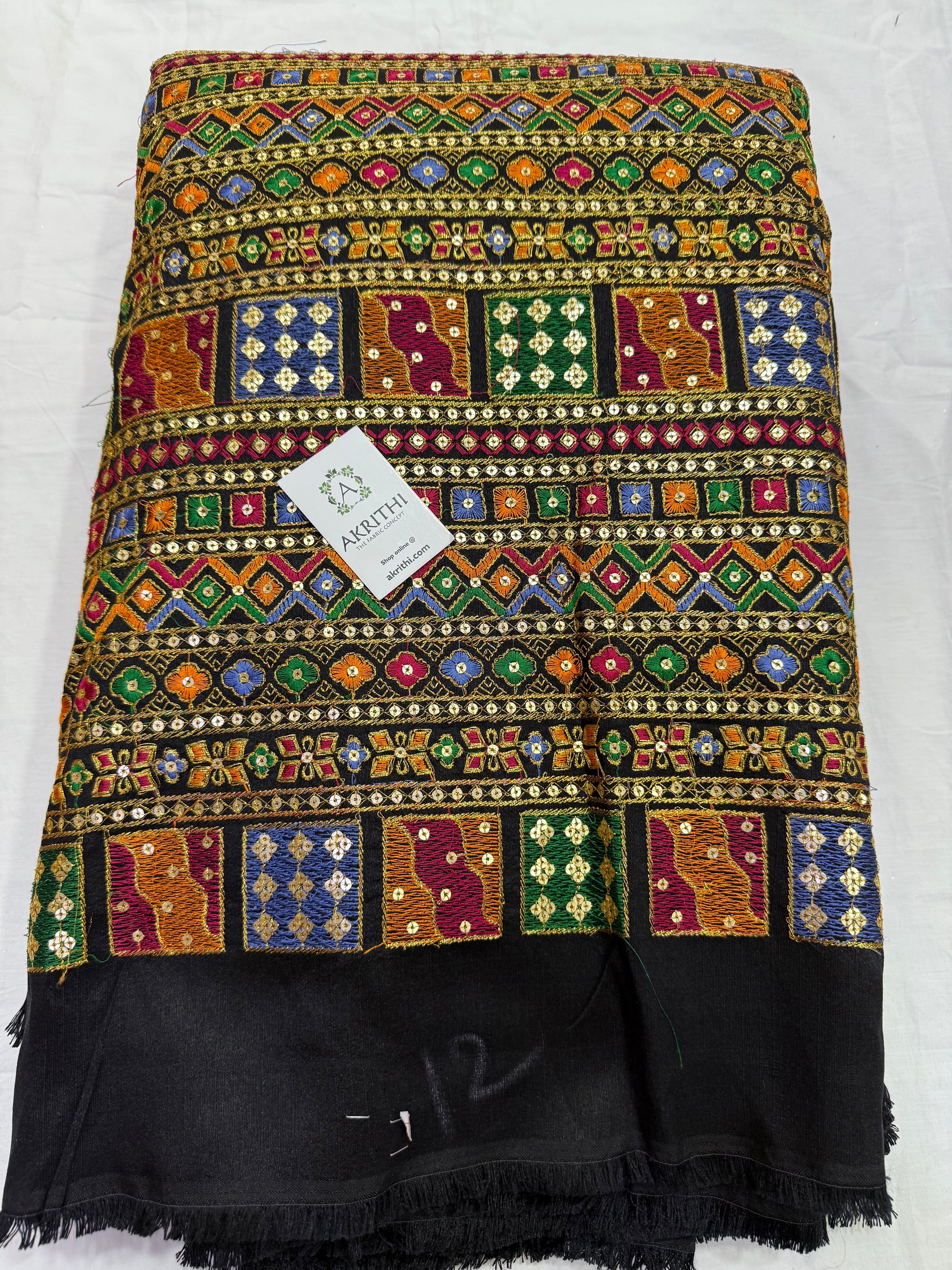 Embroidered raw silk fabric