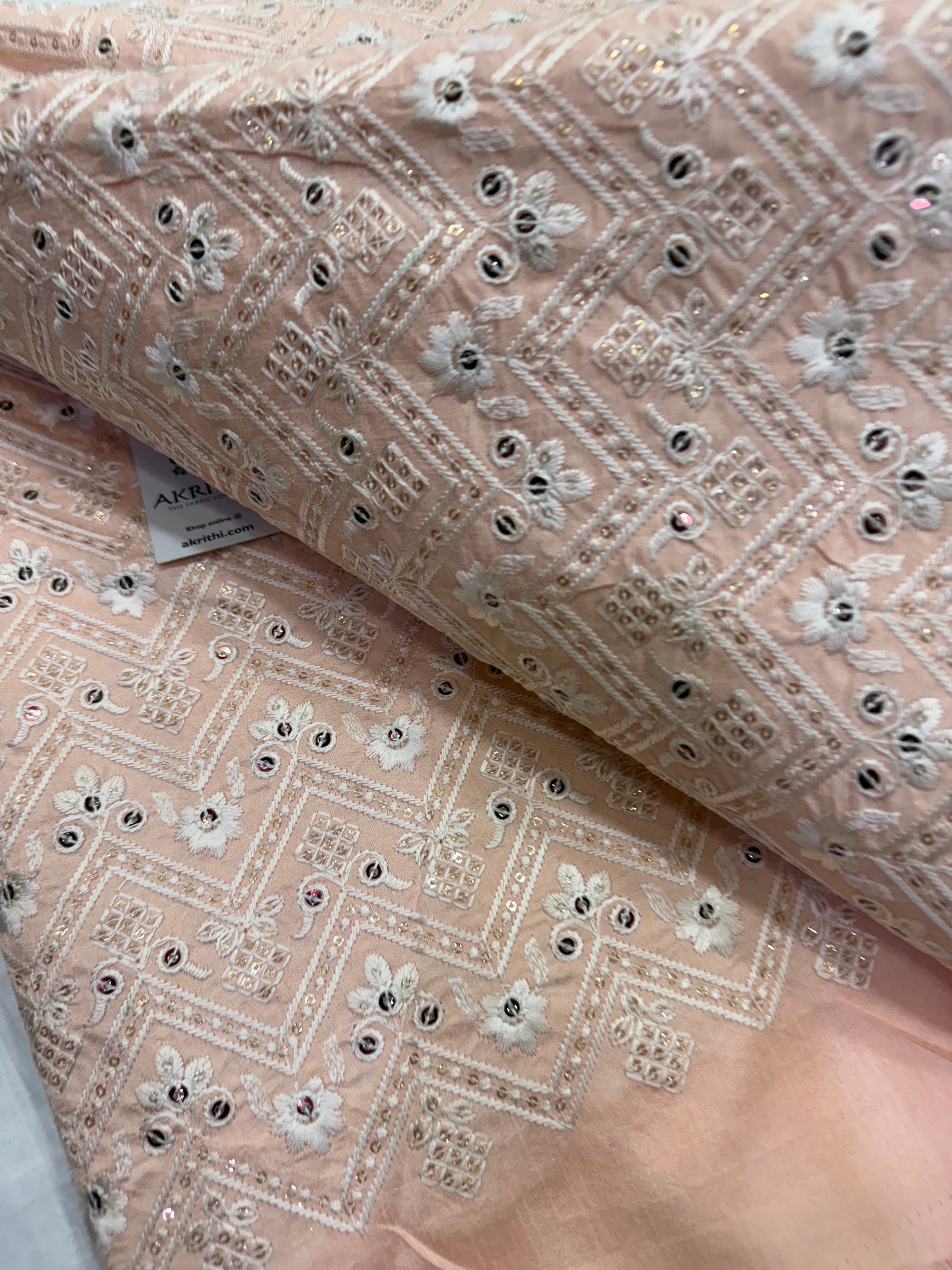 Embroidered raw silk fabric
