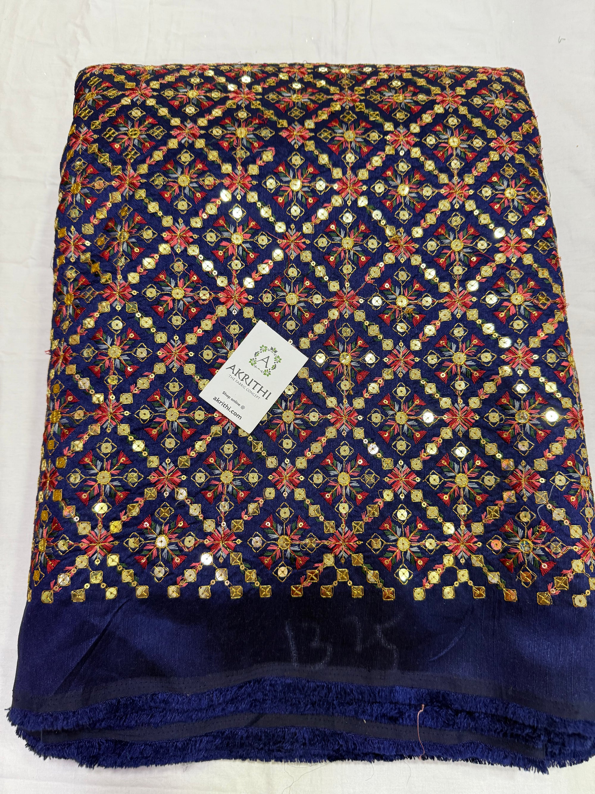 Embroidered raw silk fabric