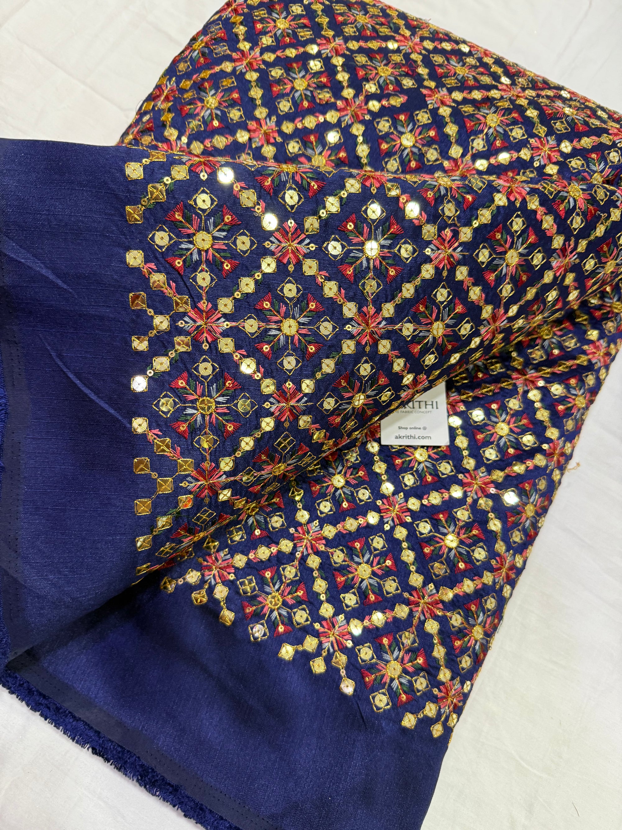 Embroidered raw silk fabric