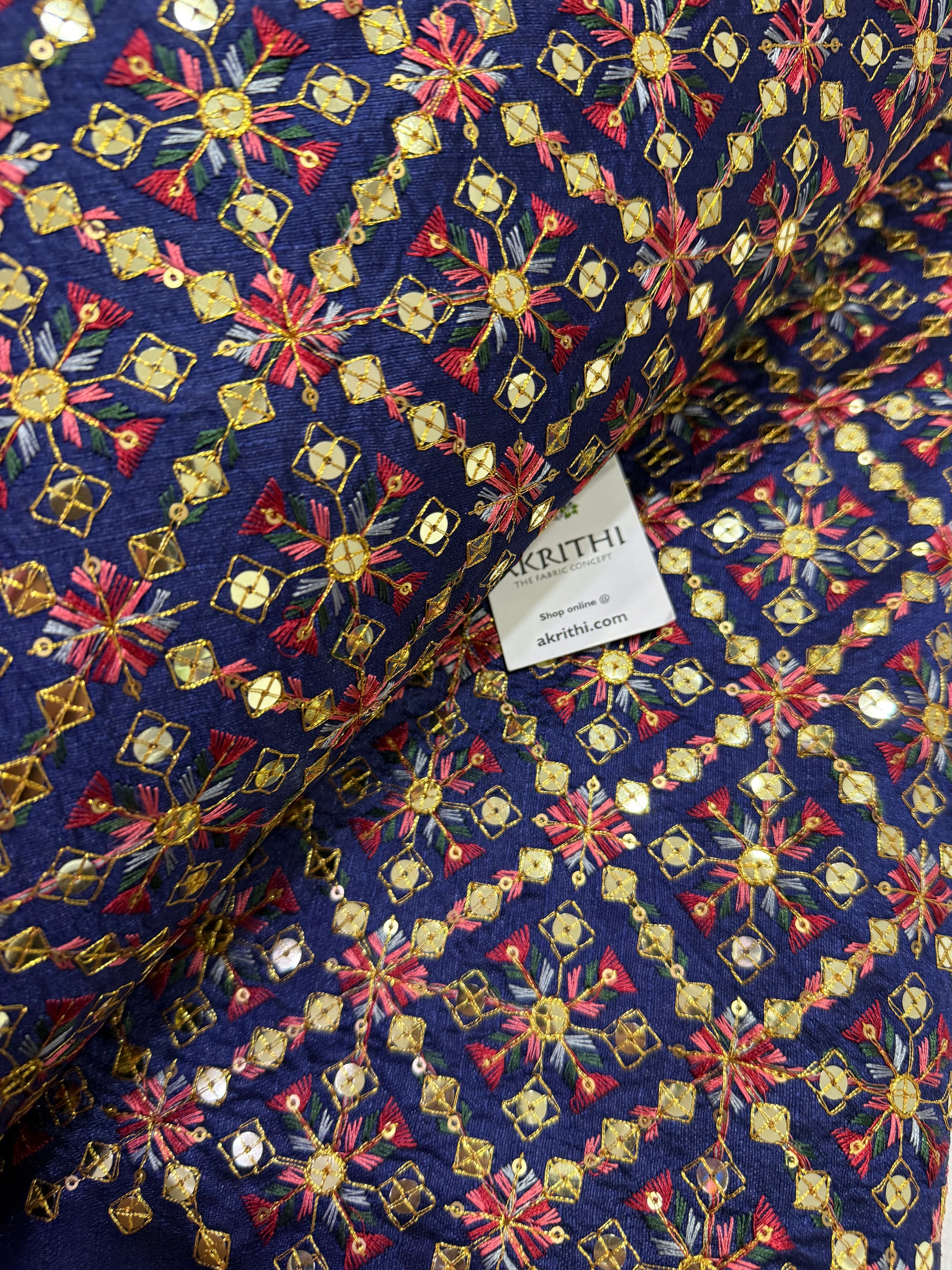 Embroidered raw silk fabric