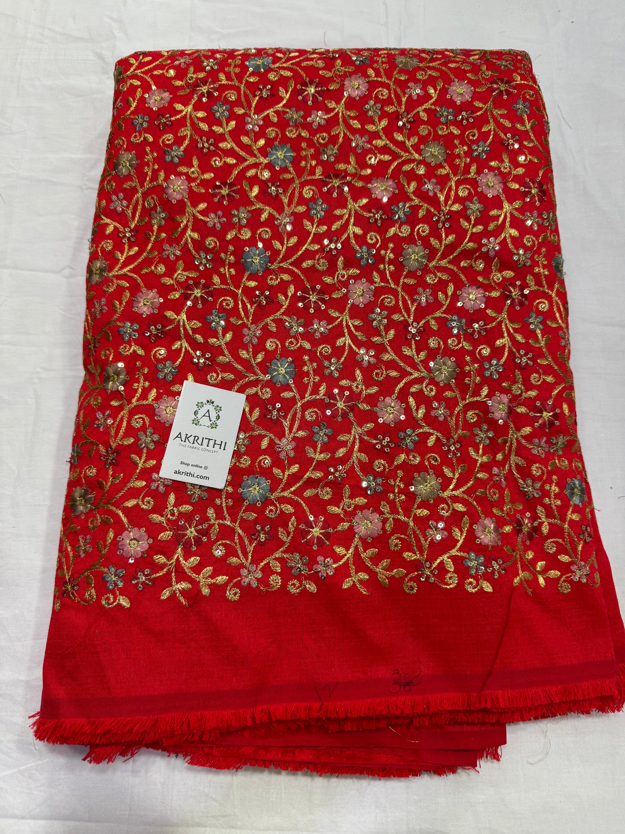 Embroidered raw silk fabric
