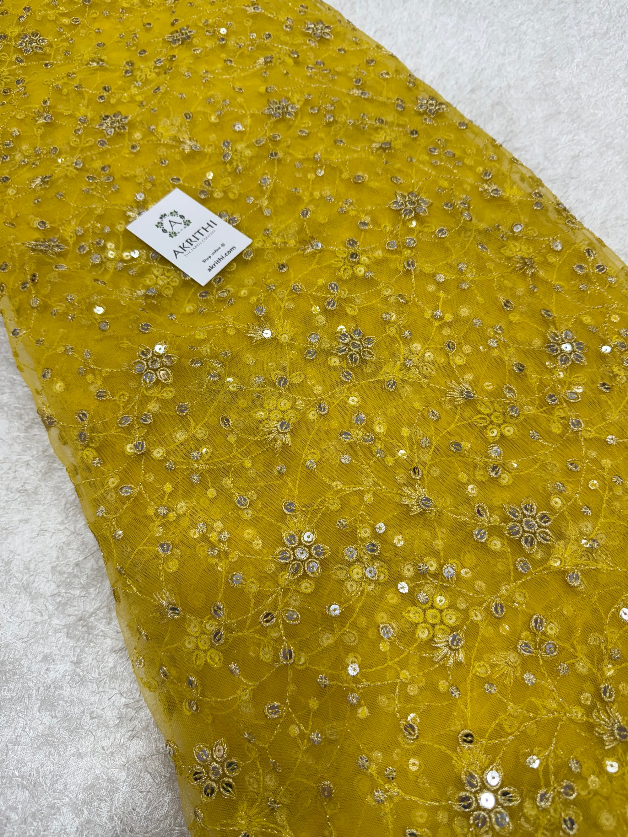 Embroidered net fabric