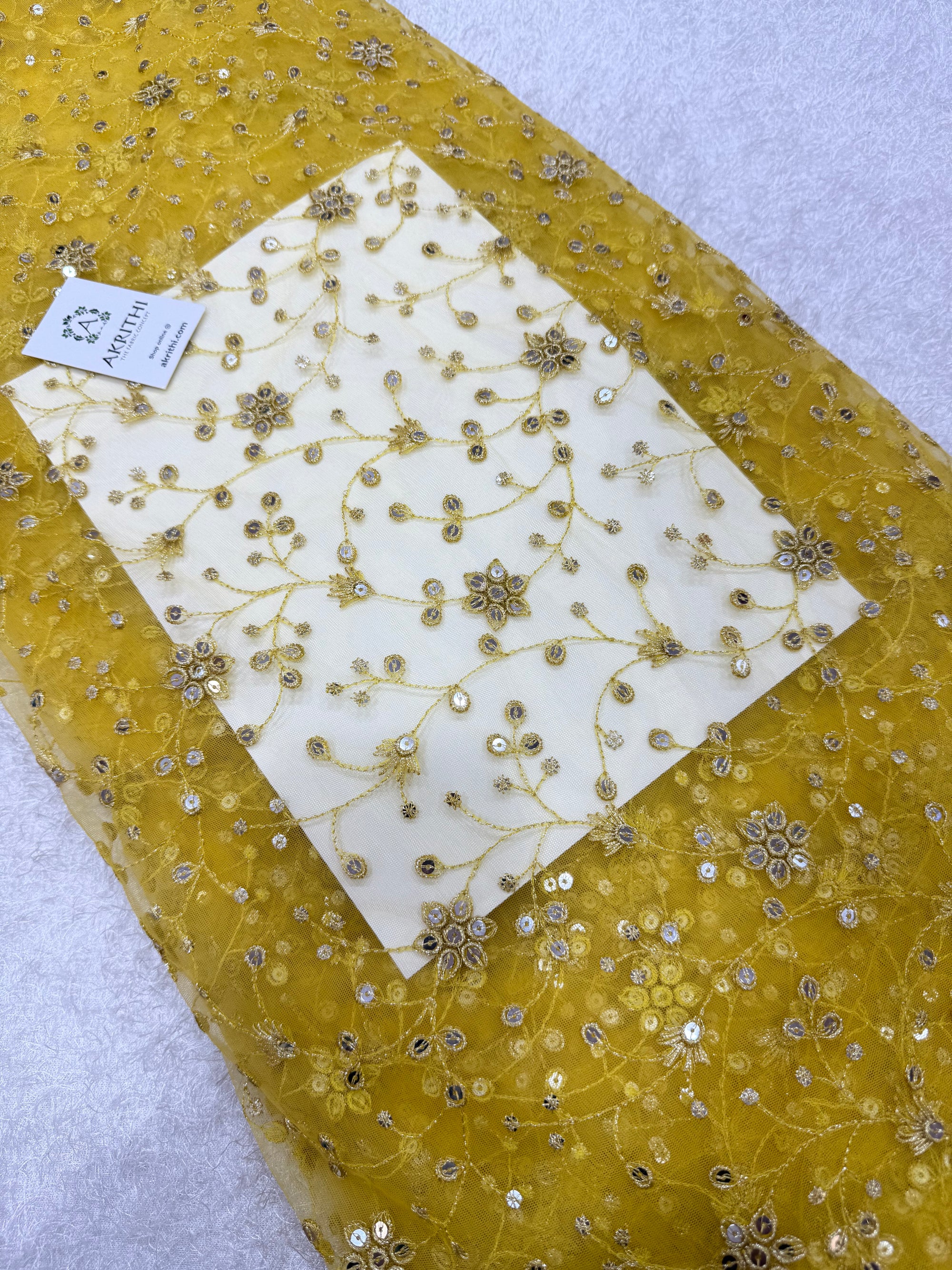 Embroidered net fabric