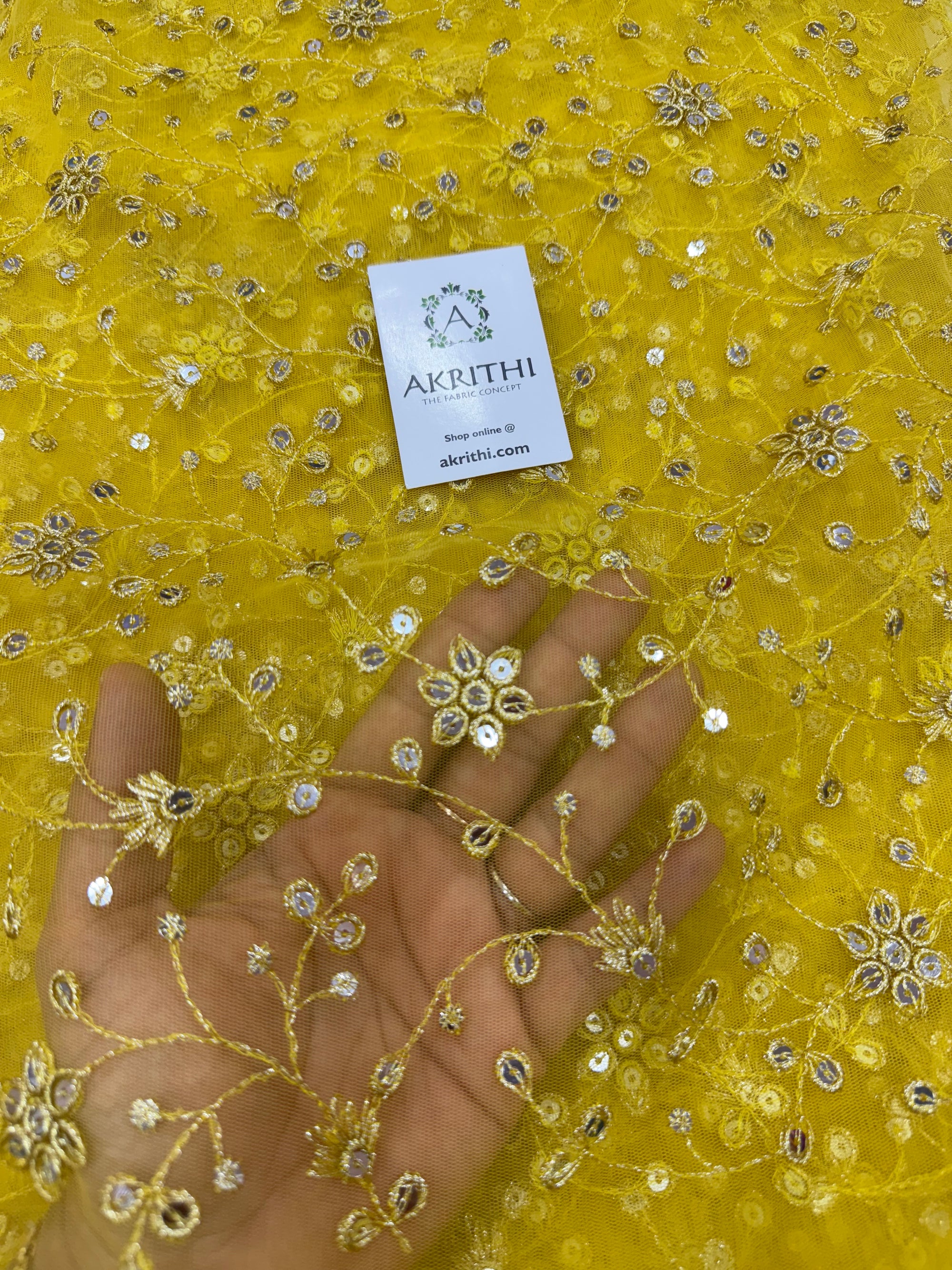 Embroidered net fabric