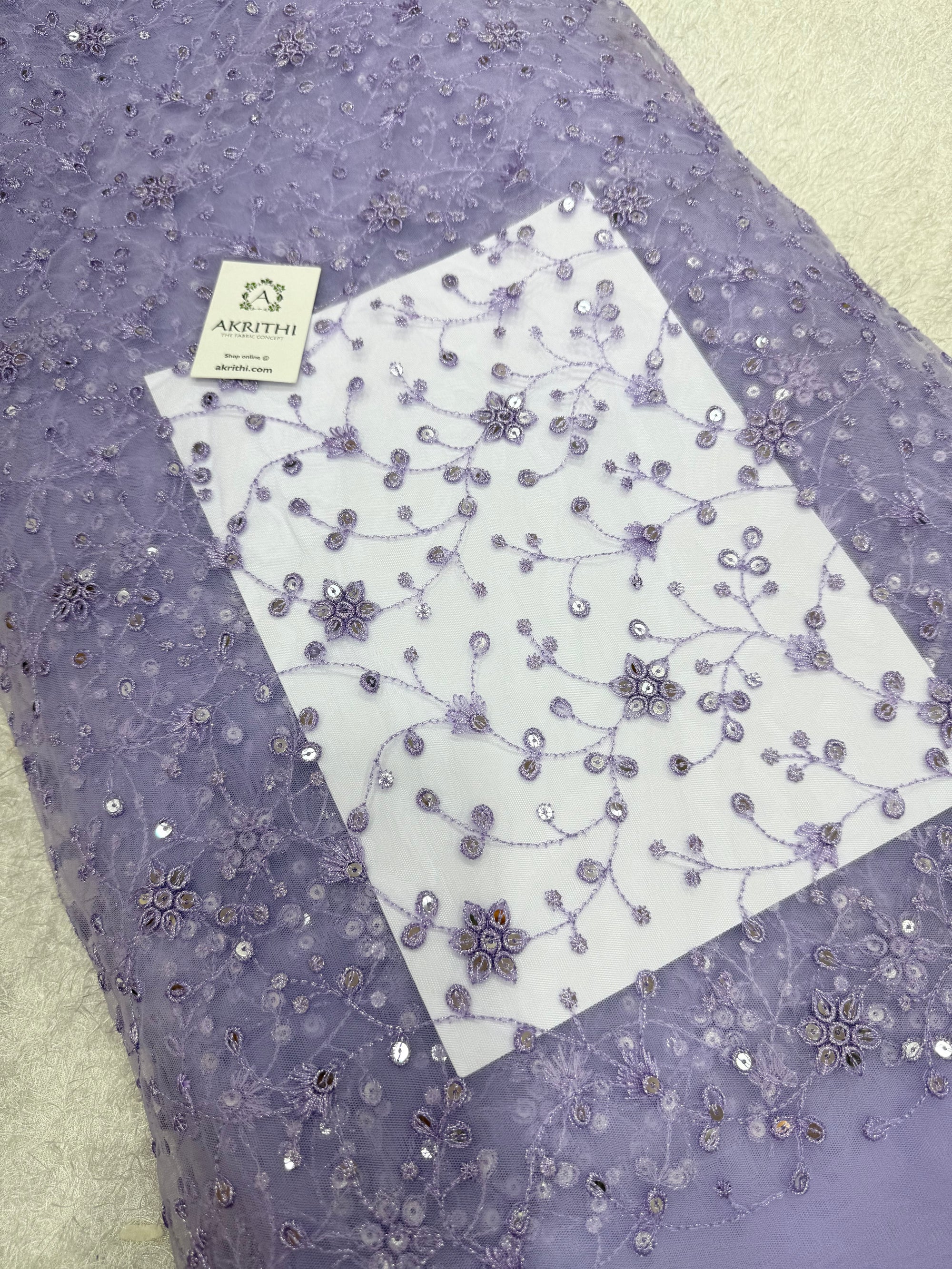 Embroidered net fabric