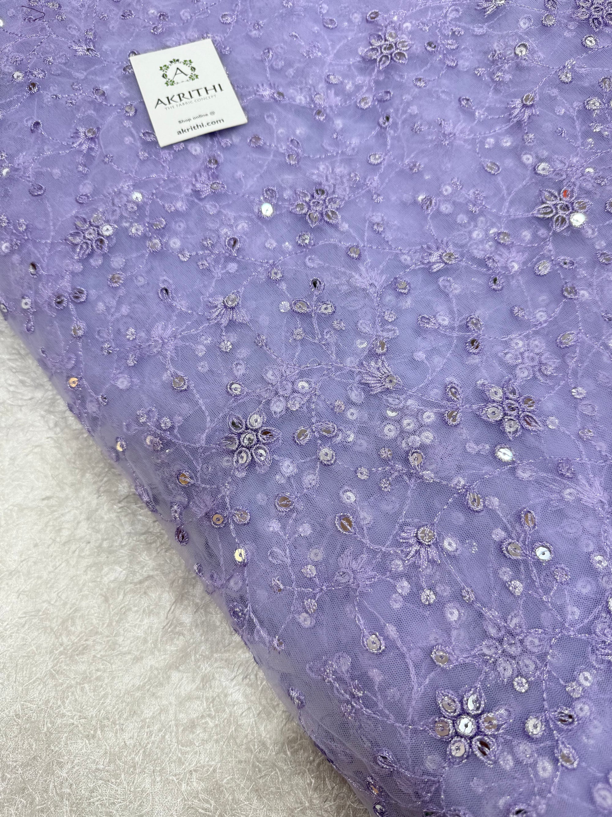 Embroidered net fabric
