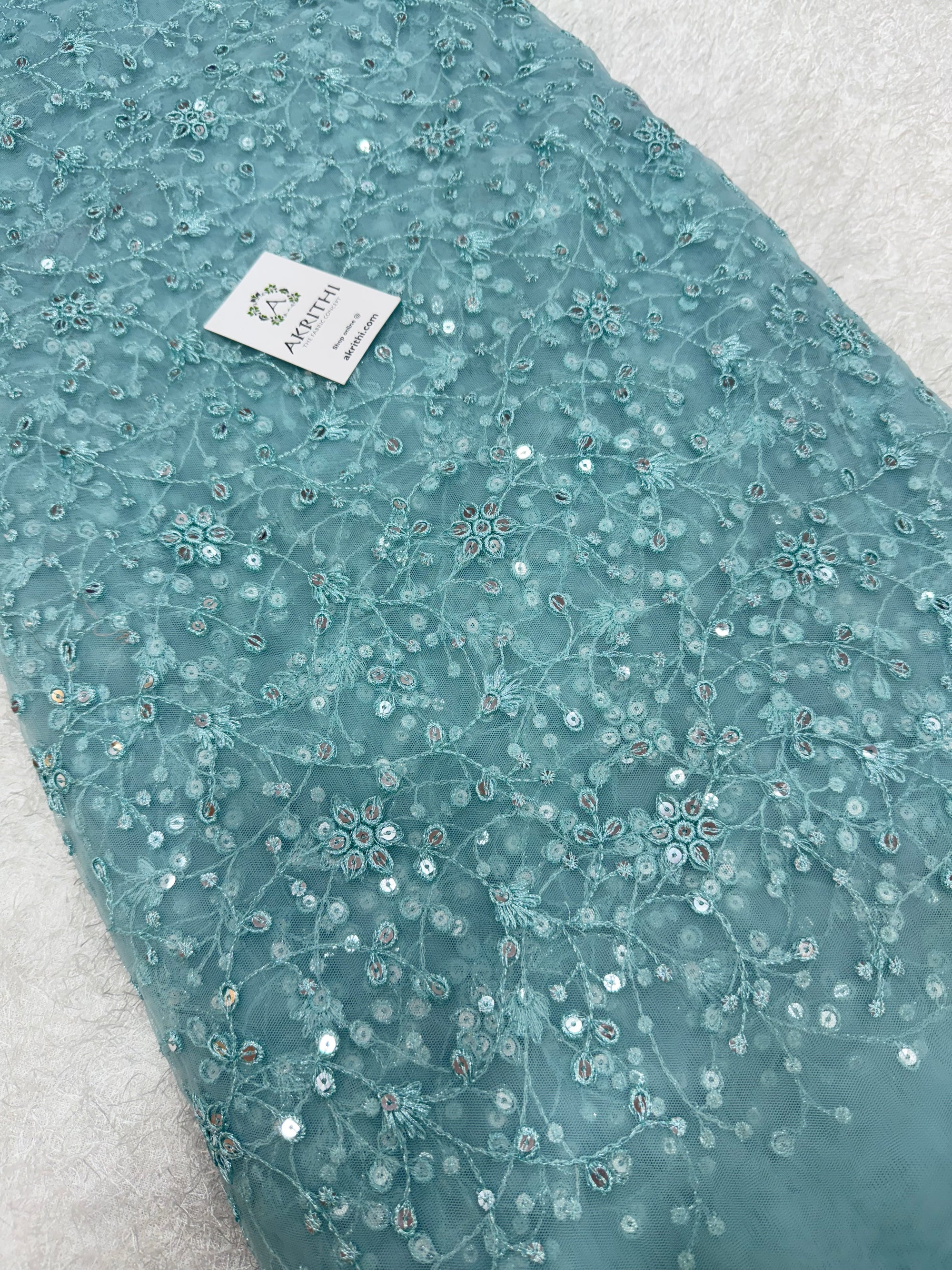 Embroidered net fabric