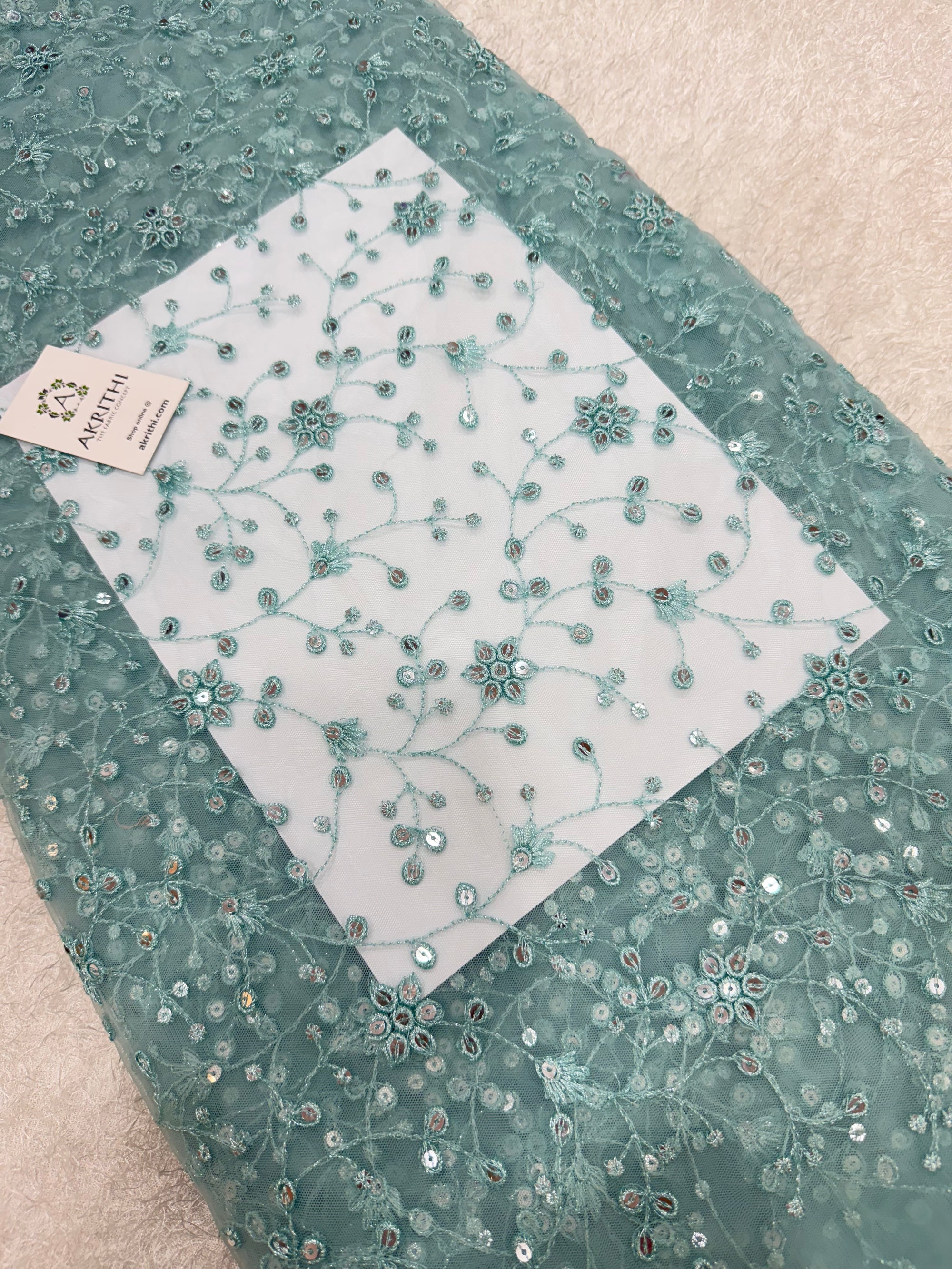 Embroidered net fabric