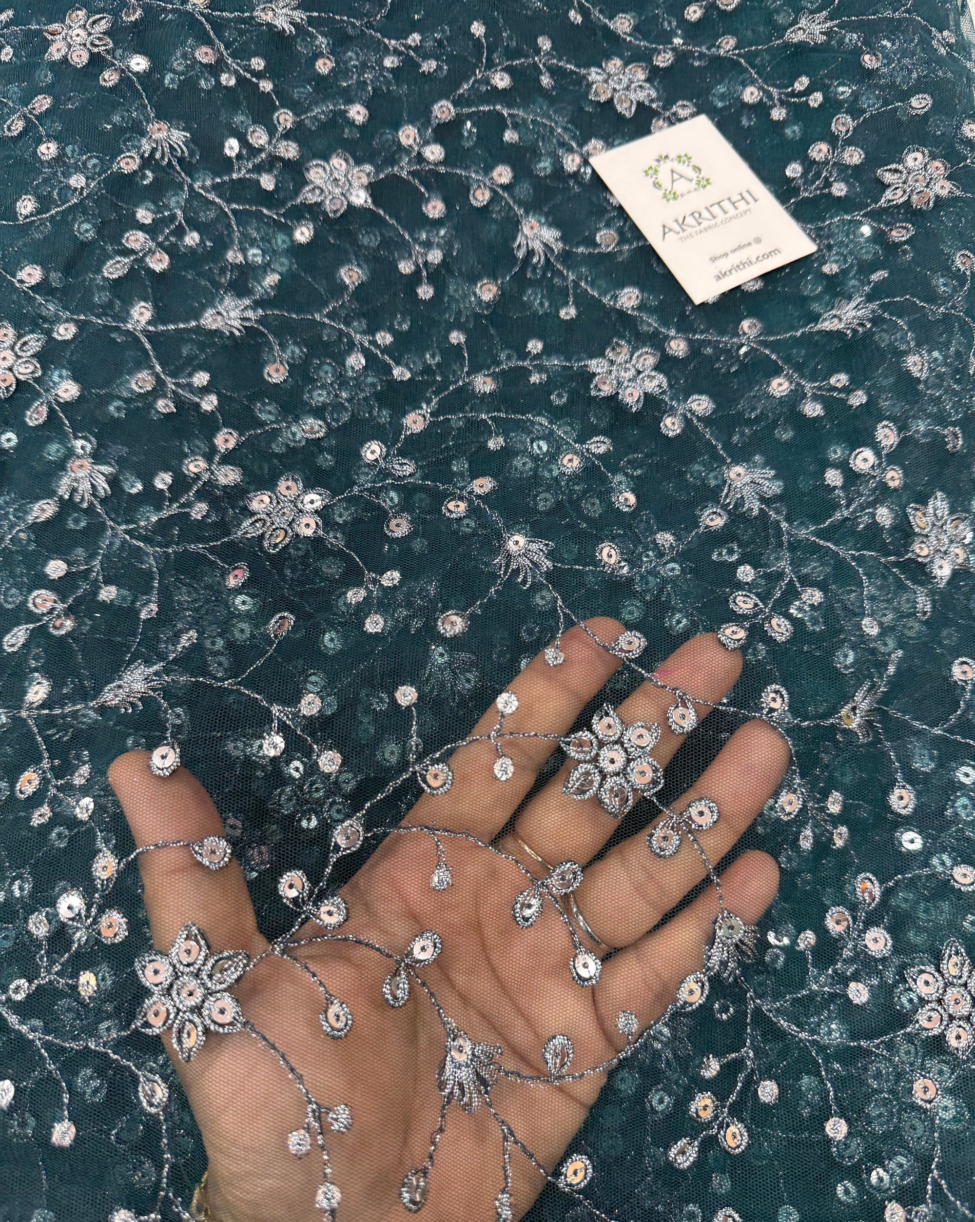 Embroidered net fabric