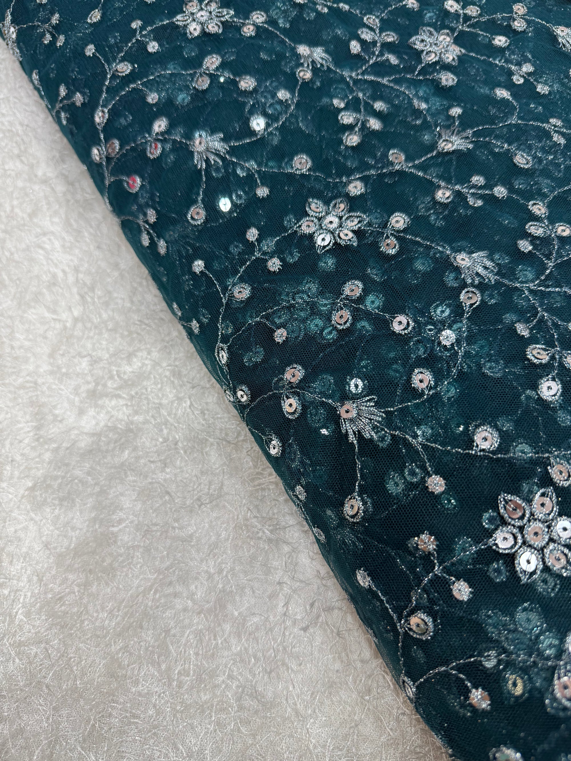Embroidered net fabric