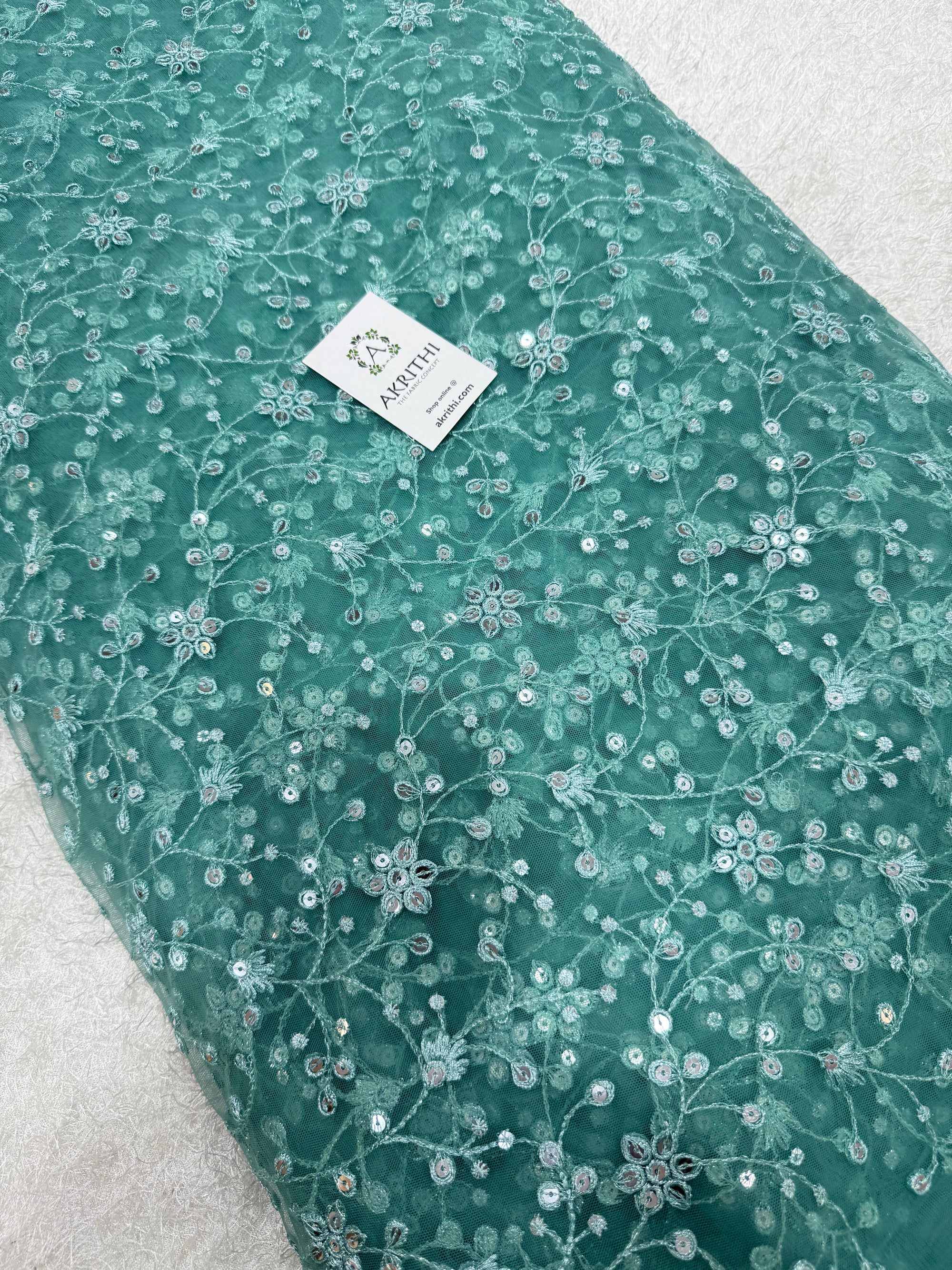 Embroidered net fabric