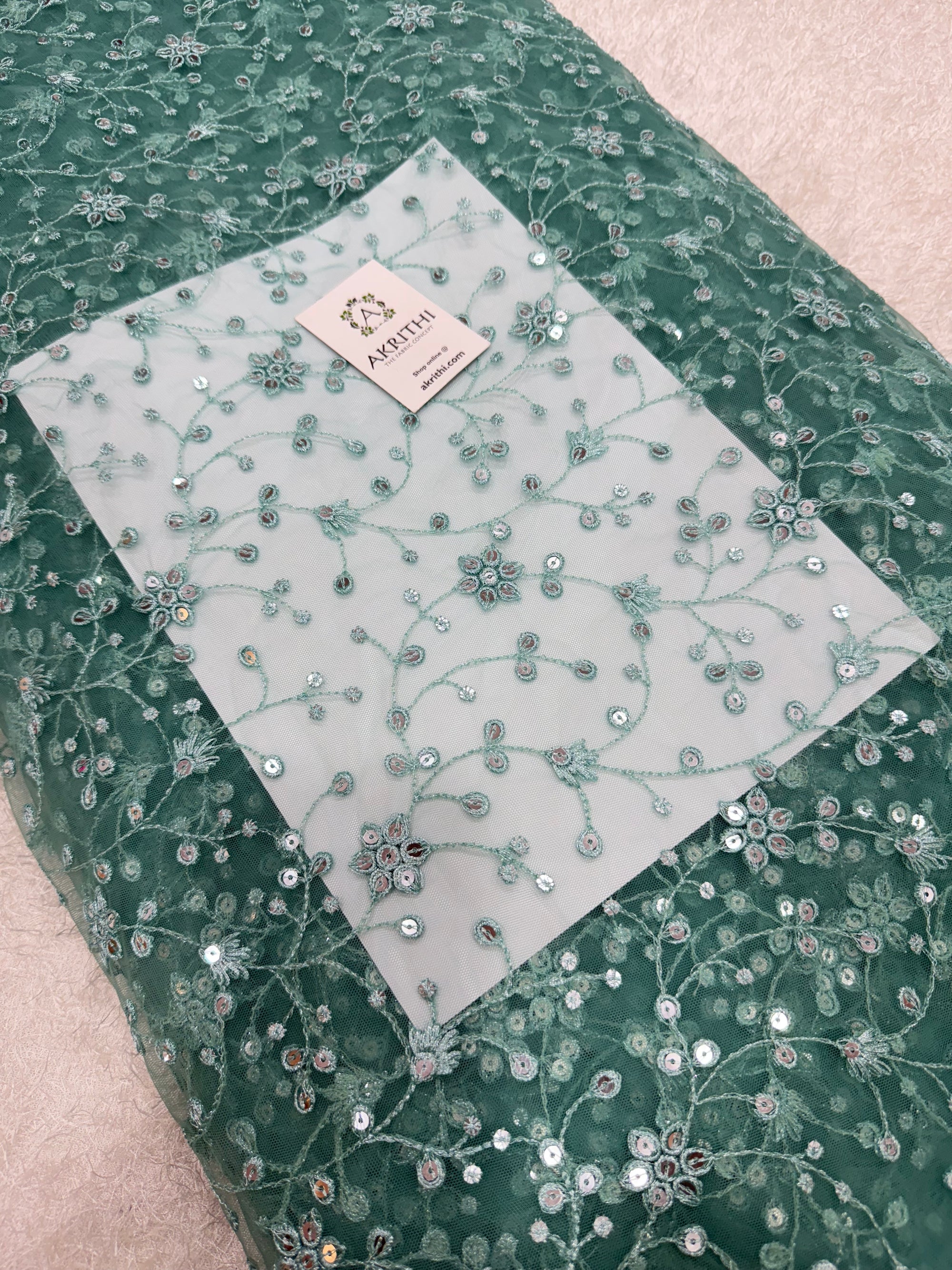 Embroidered net fabric