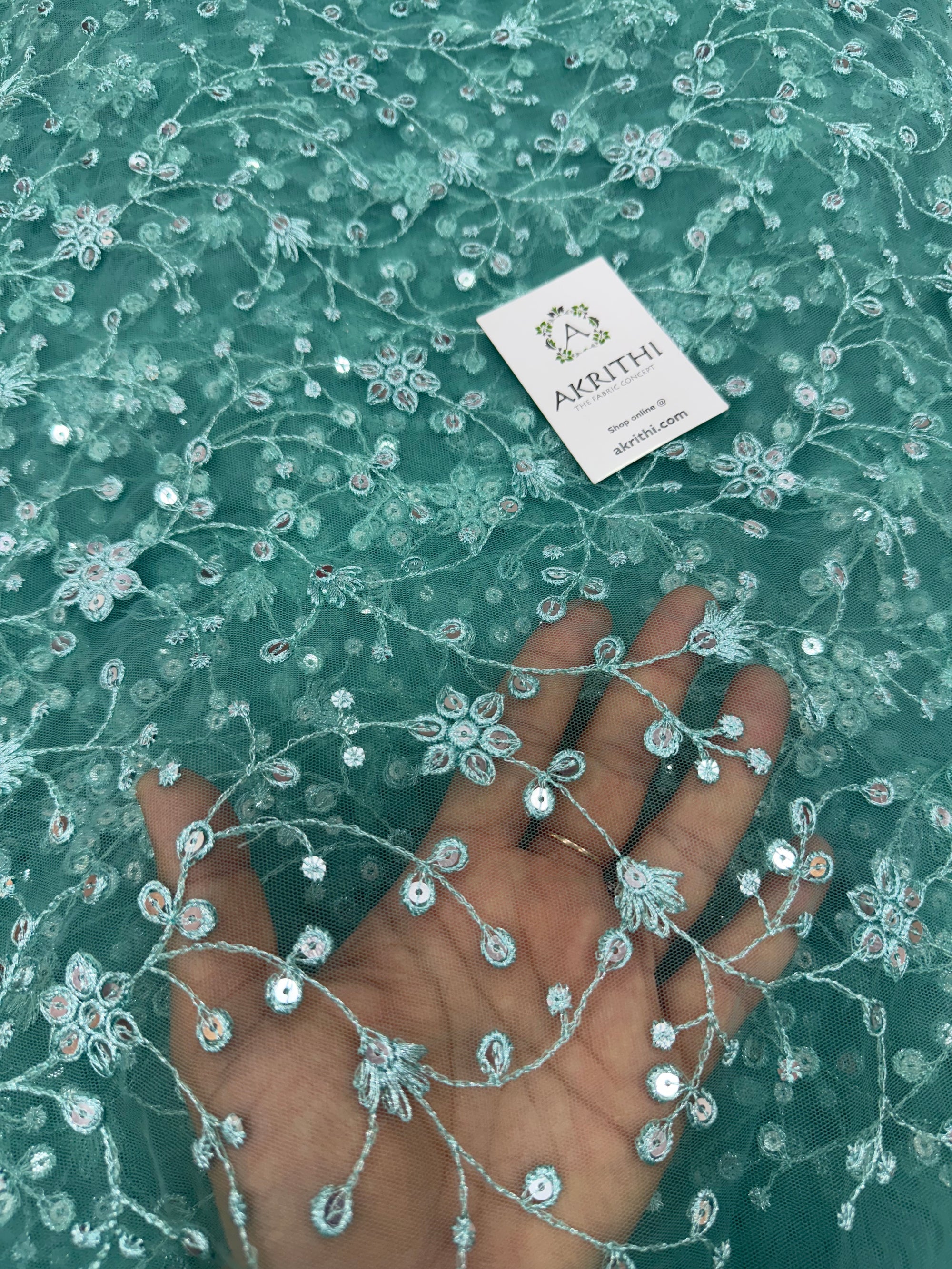 Embroidered net fabric