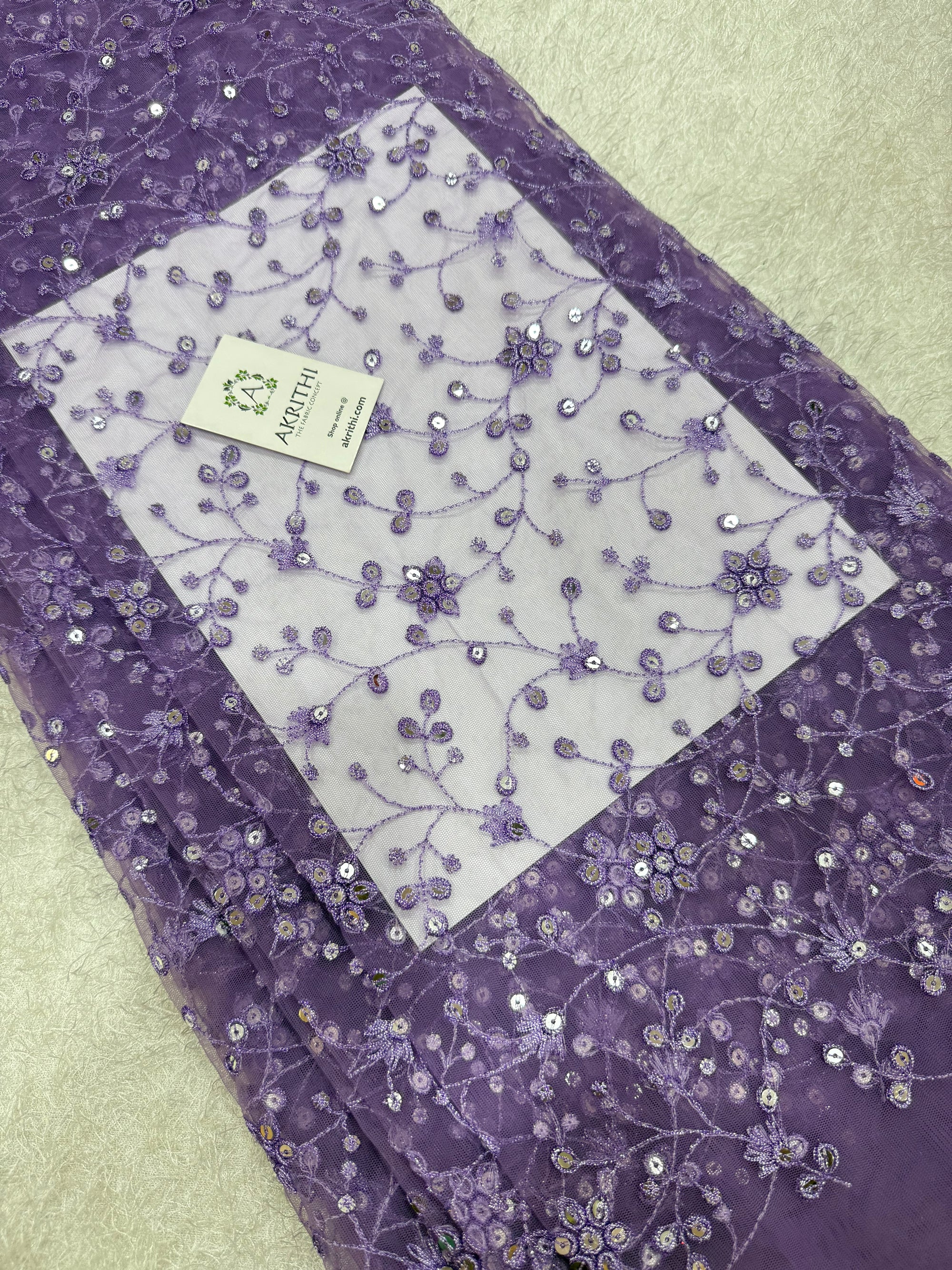 Embroidered net fabric