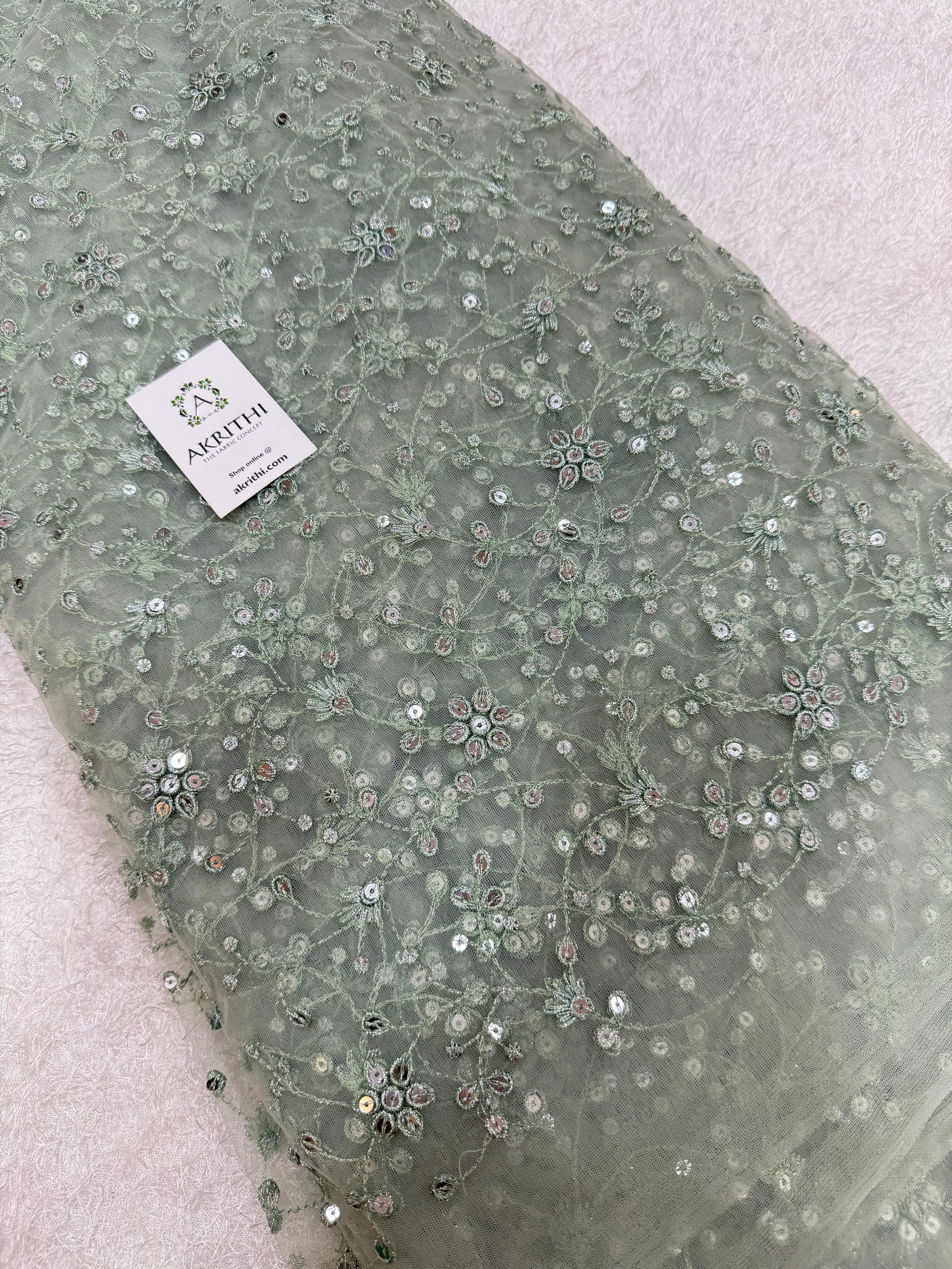 Embroidered net fabric