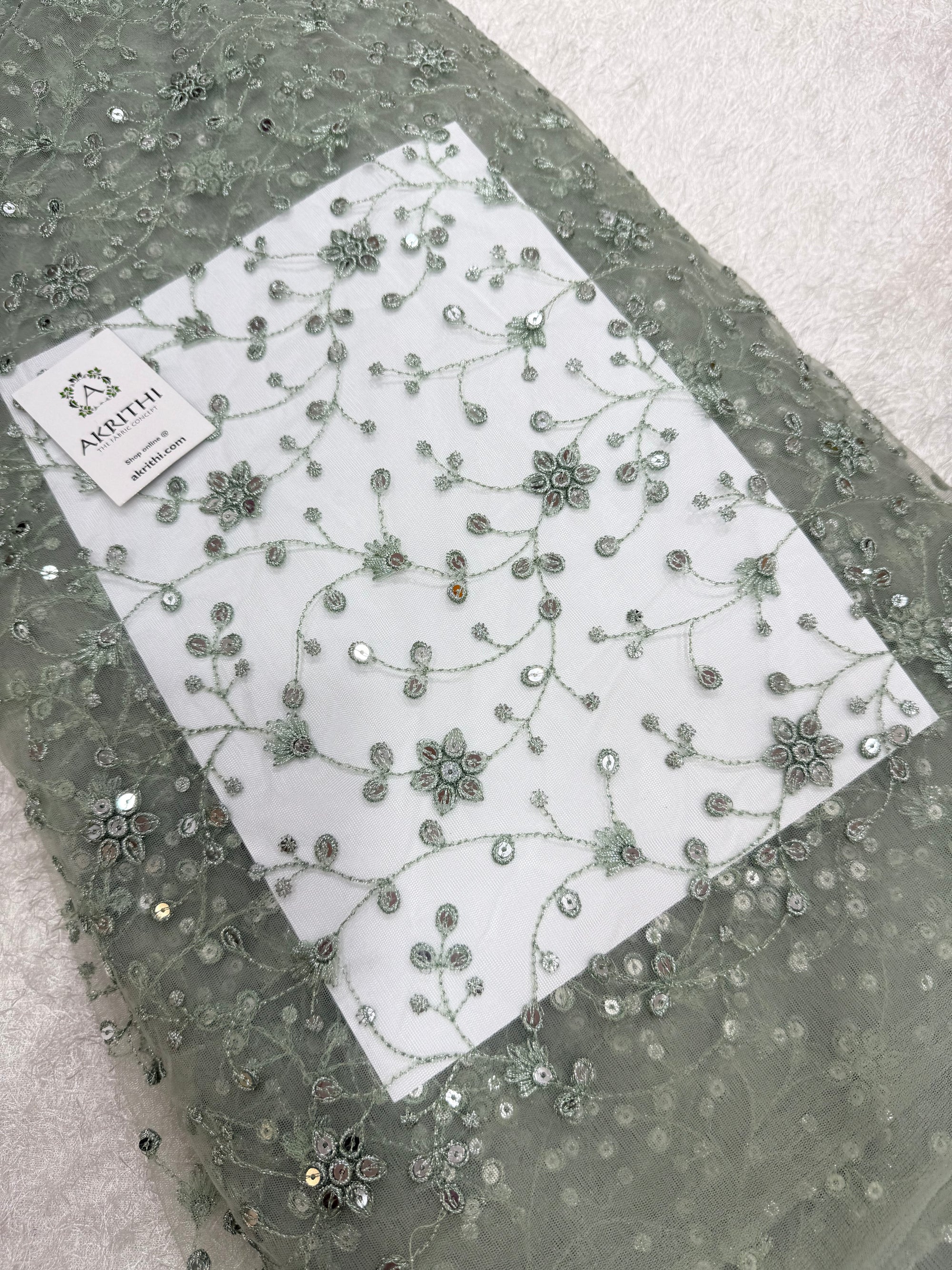 Embroidered net fabric